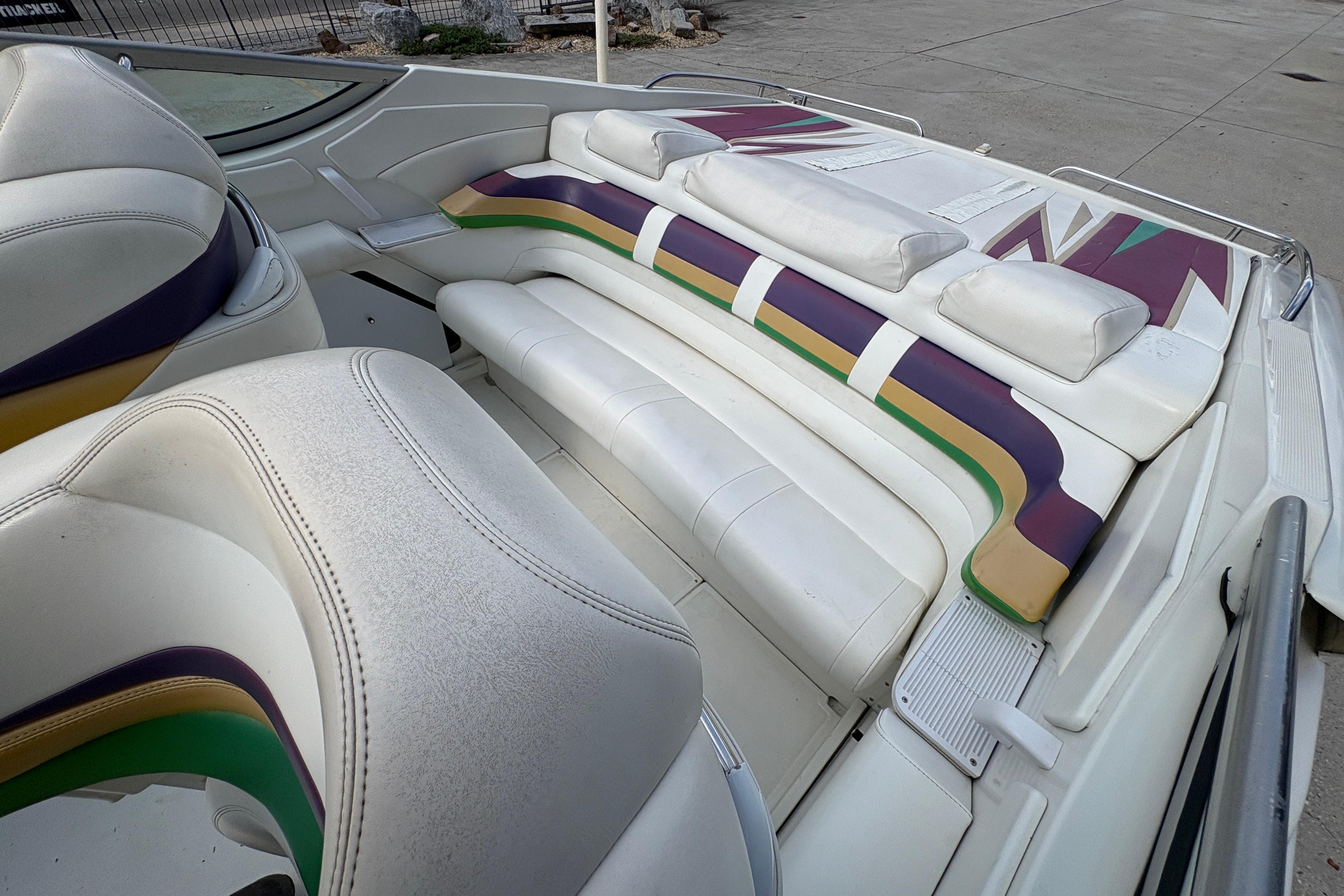 2002 Formula 292 FASTech boat interior with colorful seating design.