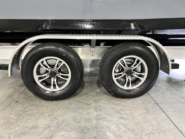 Tidewater 232 CC Adventure 2023 on trailer with dual wheels.