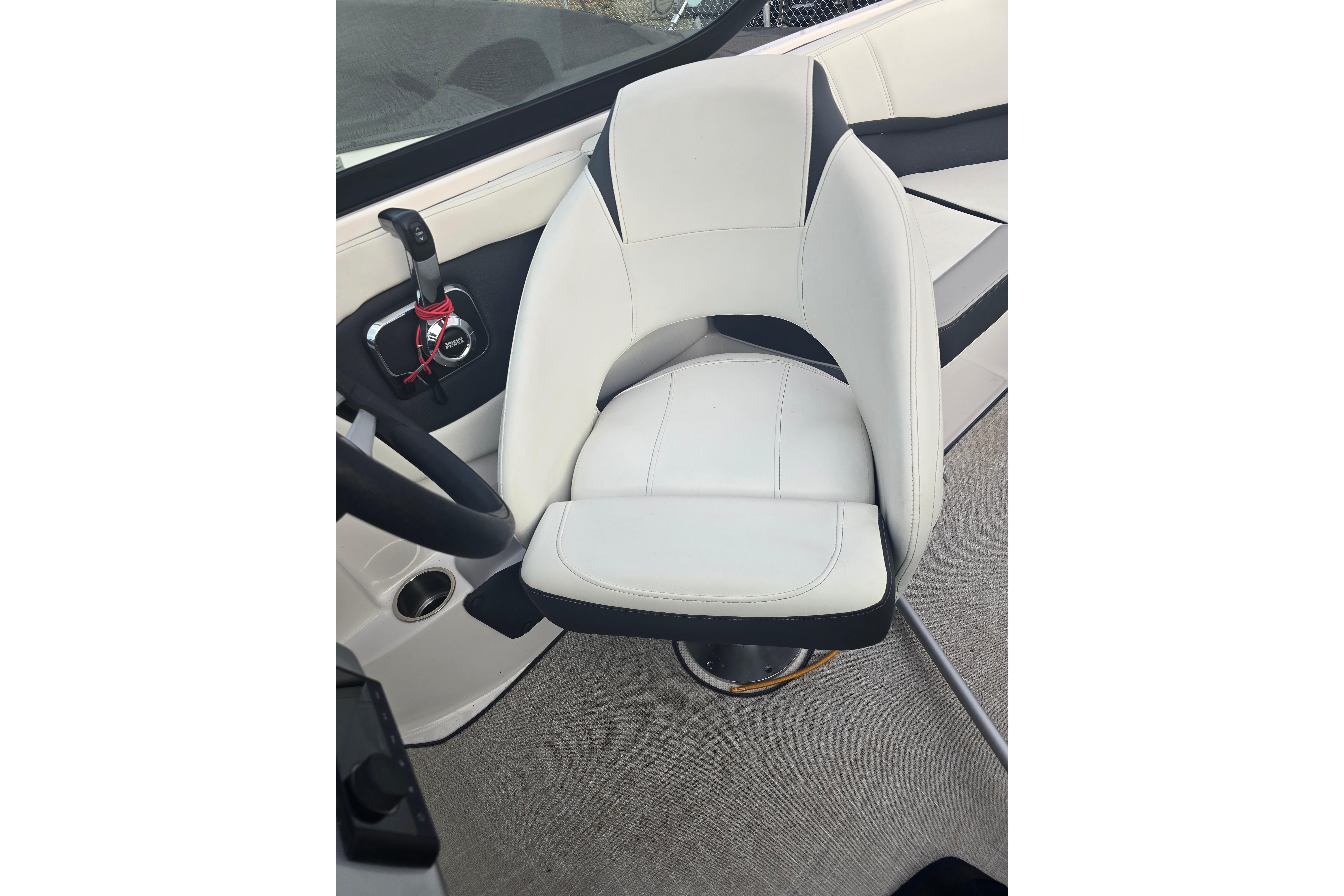 White captain's chair in 2022 Regal 2000 ES boat interior.