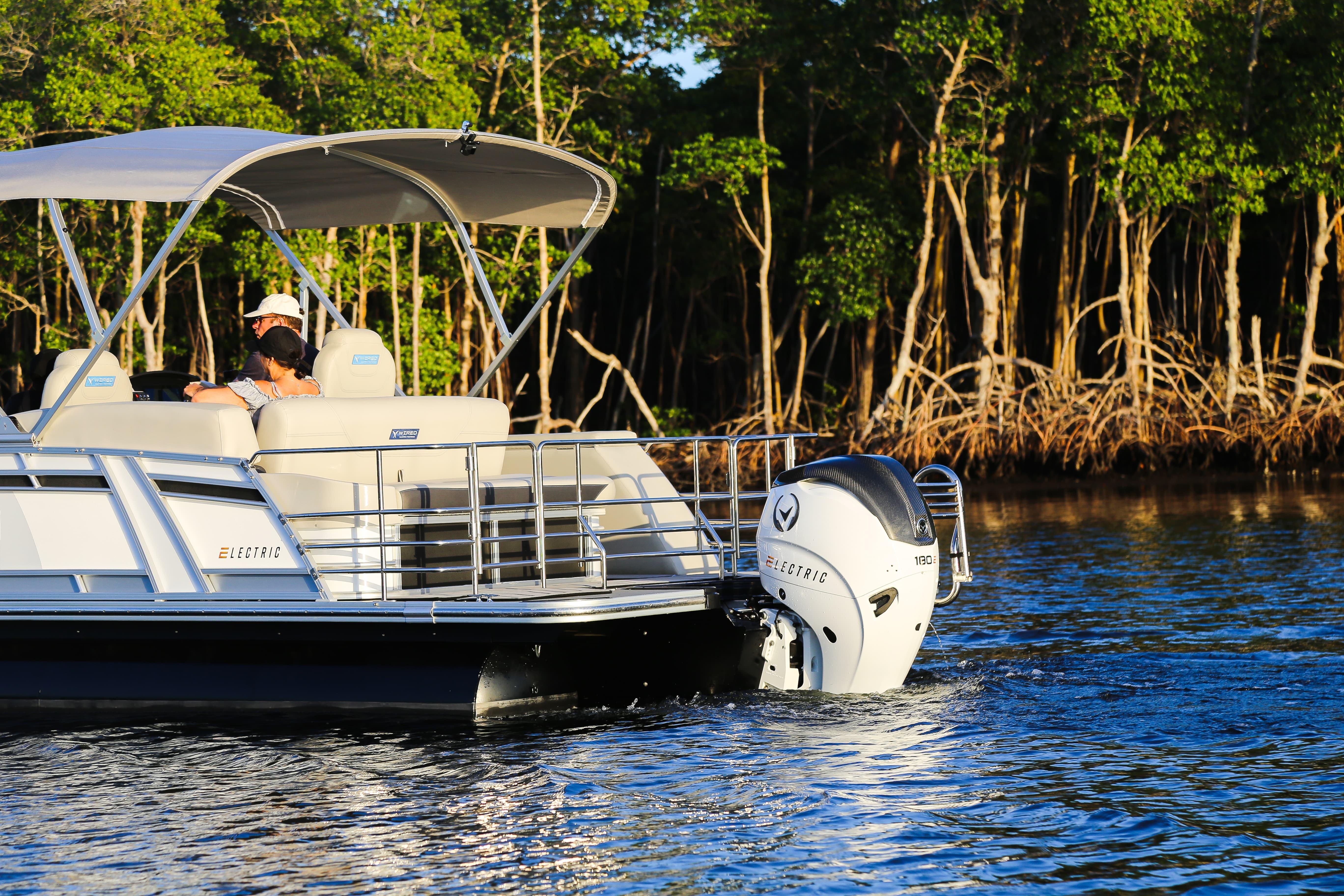 Electric Vision Marine Technologies V24 boat cruising near mangroves, 2025 model.