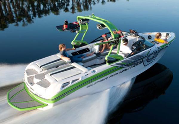 Manufacturer Provided Image: 2013 Nautique Super Air Nautique 230 speedboat on a calm lake.