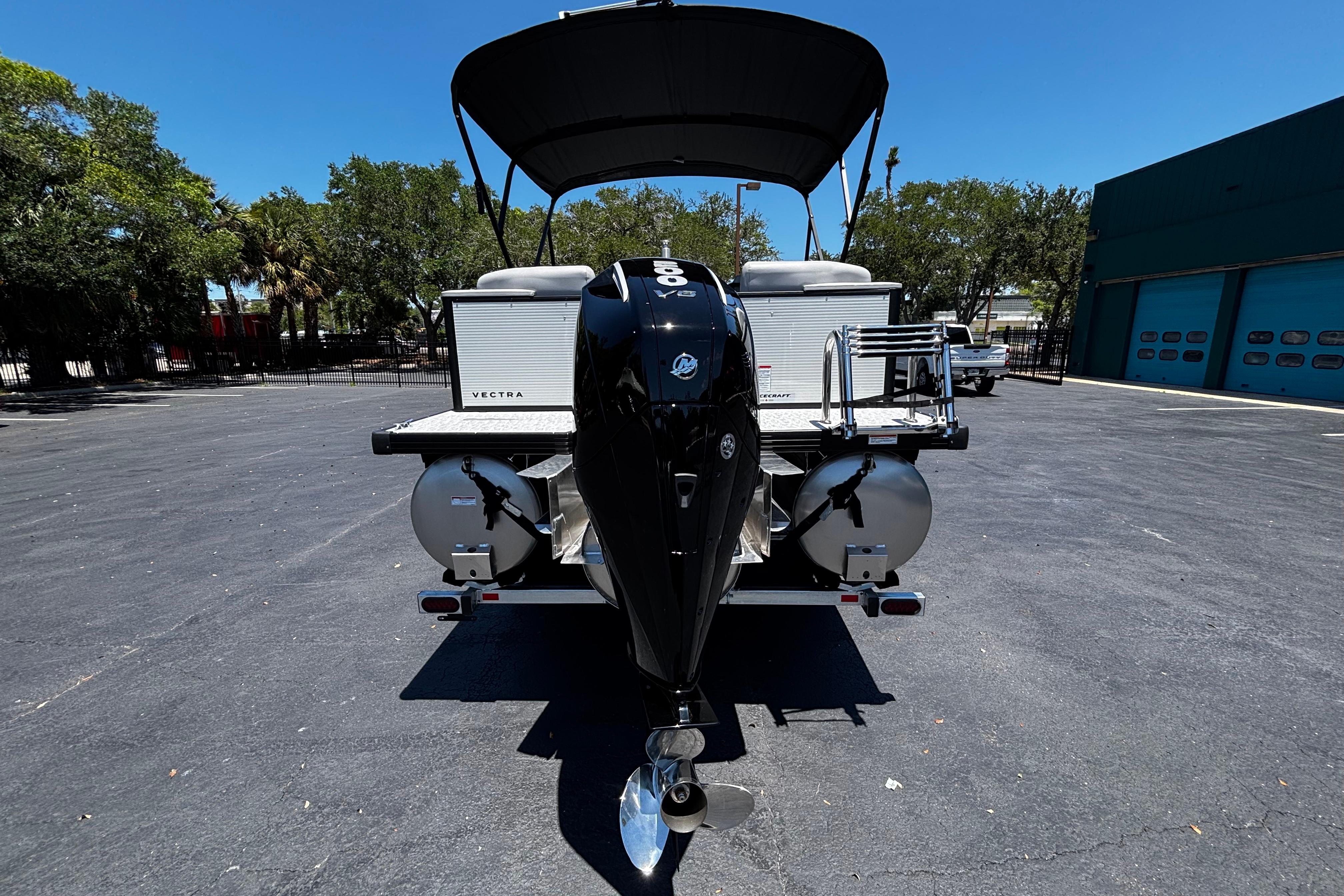 2026 Princecraft Vectra 23 QL pontoon boat with powerful outboard motor, parked outdoors.