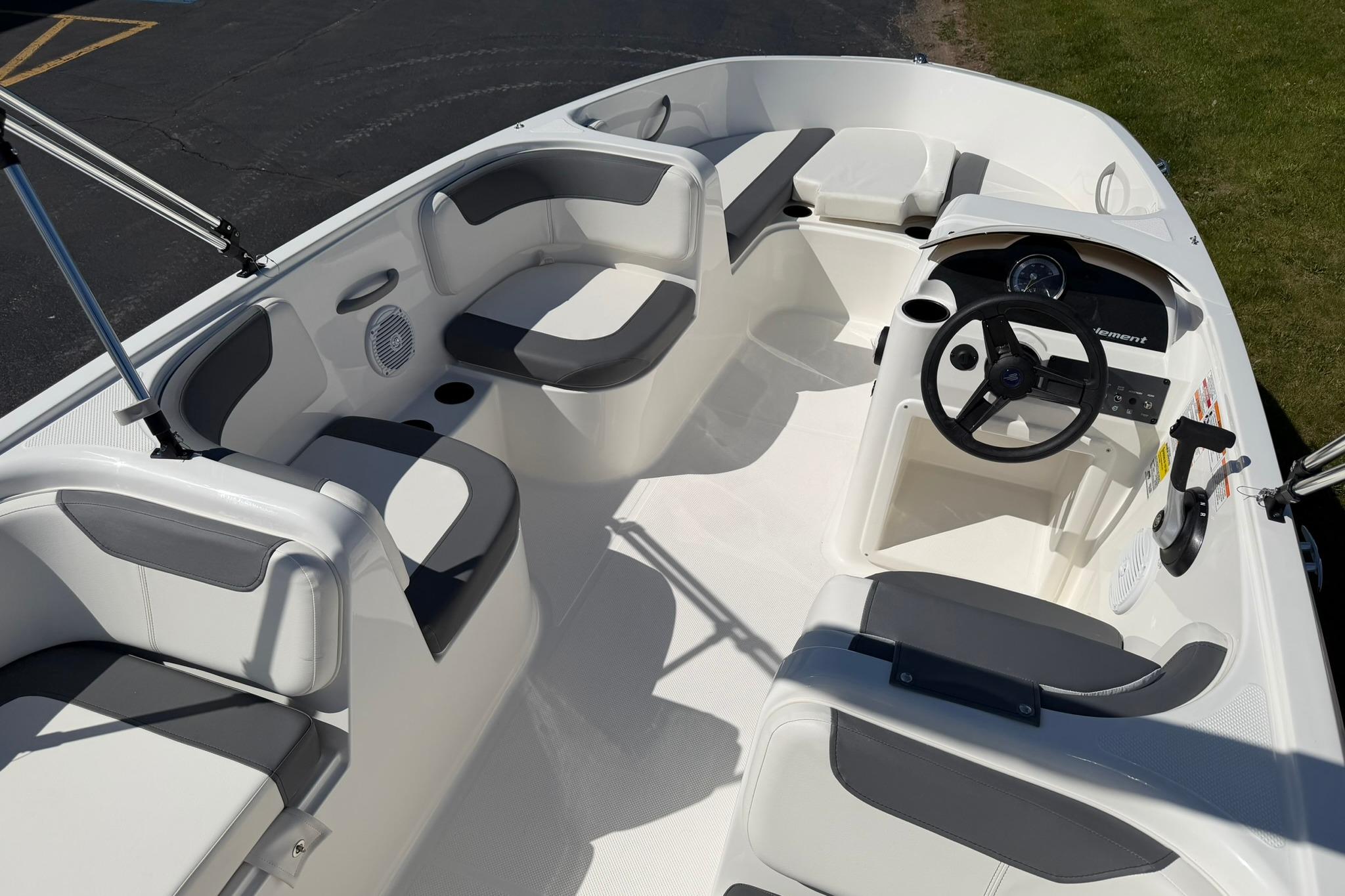 2026 Bayliner Element E18 boat interior with seating and steering wheel.