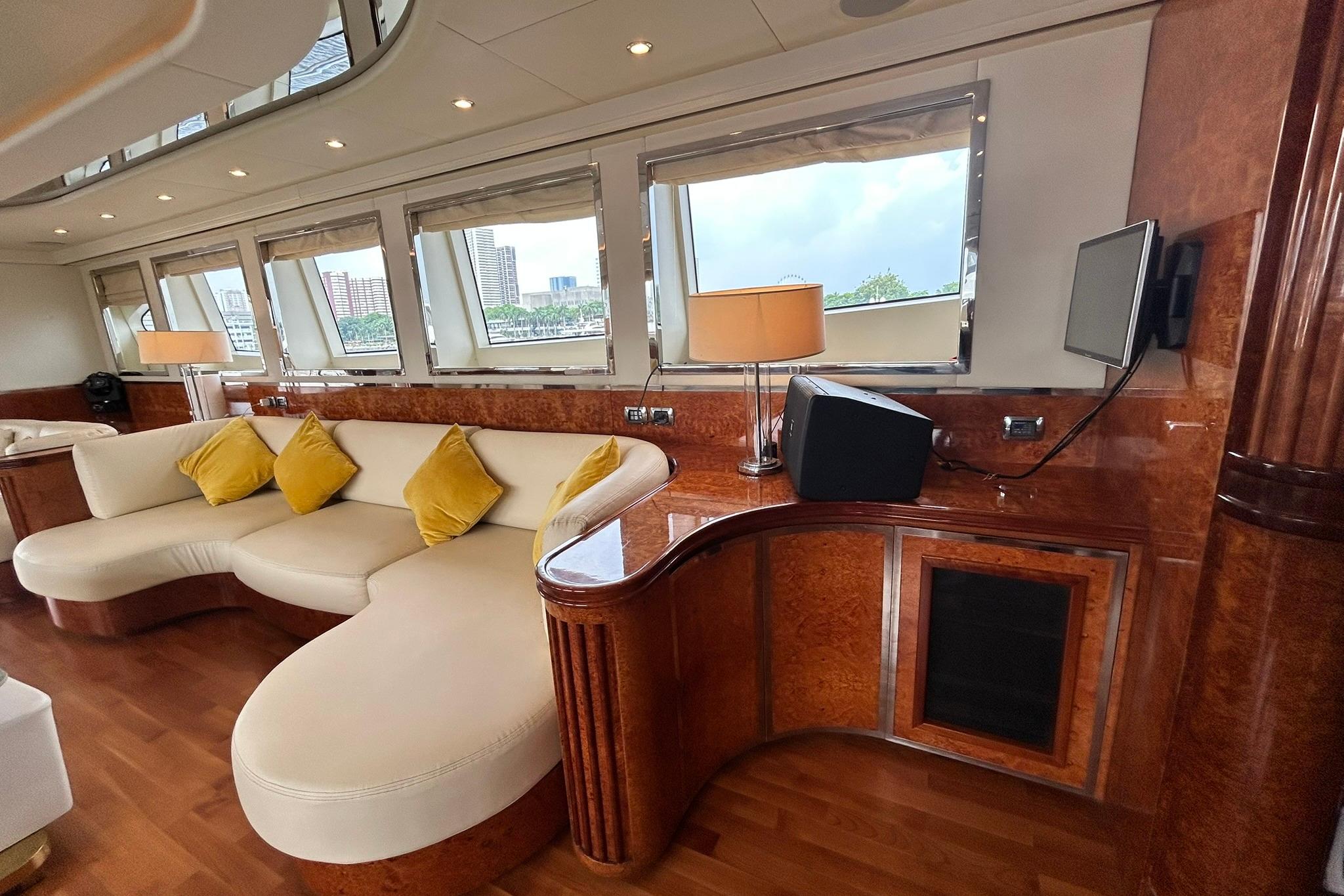 Luxurious interior of 2010 Versilcraft Euroyacht Planet 125S with elegant seating and wood finishes.