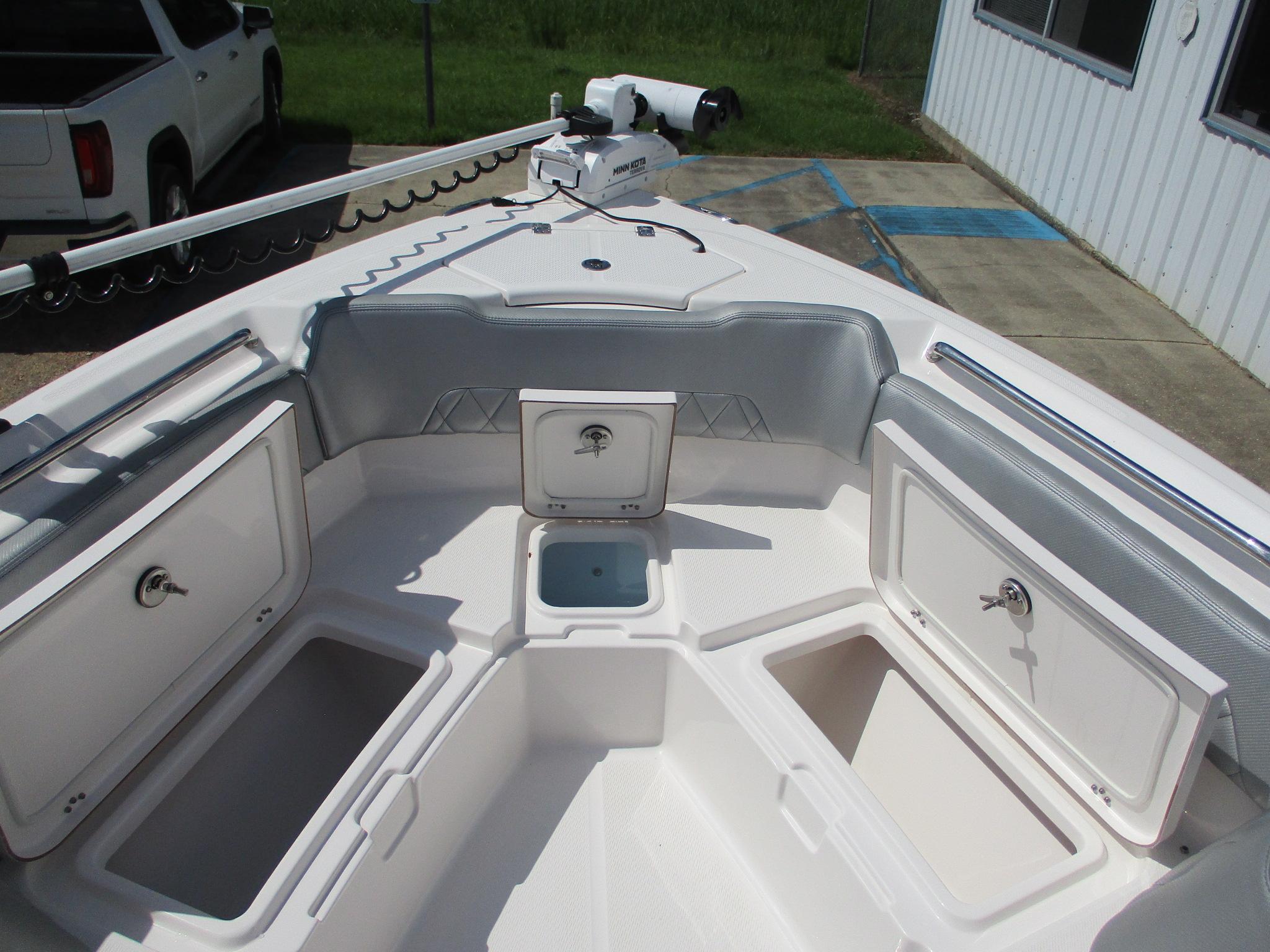 2024 Blue Wave 2800 Makaira boat interior with storage compartments and seating.