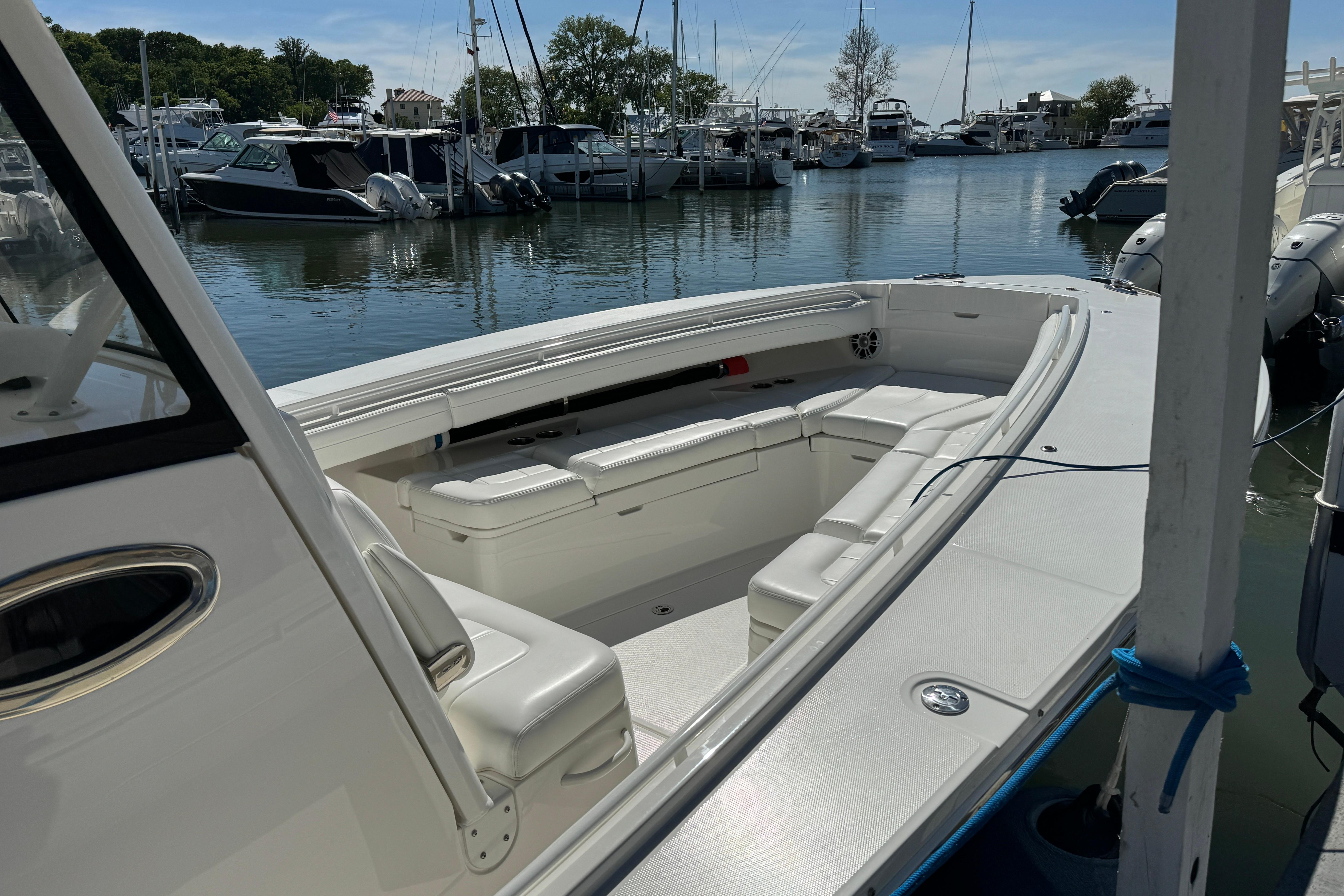 2021 Regulator 31 boat docked in a marina, featuring spacious seating and sleek design.