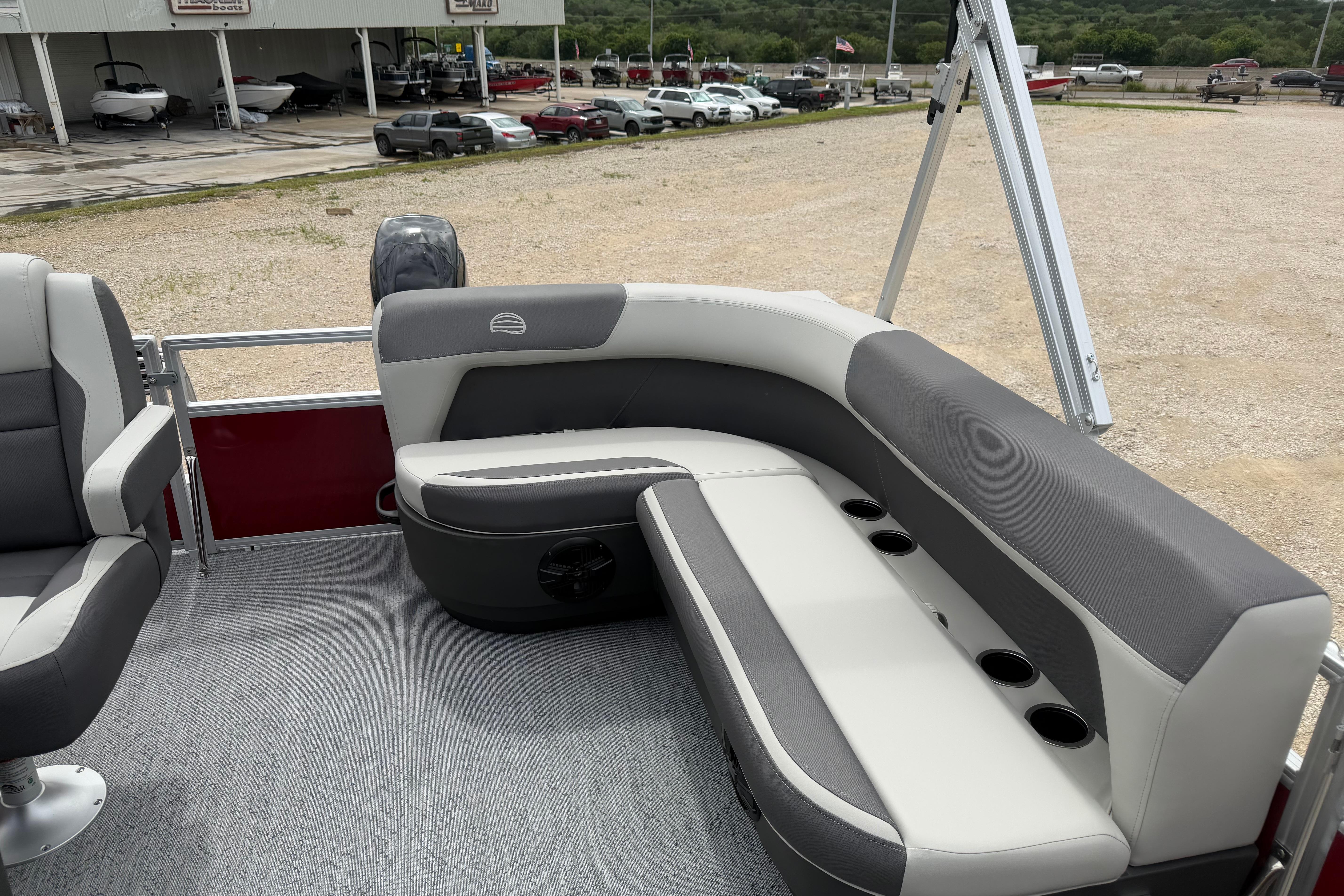 2026 Sun Tracker Bass Buggy 16 XL Select pontoon boat interior with gray seating.