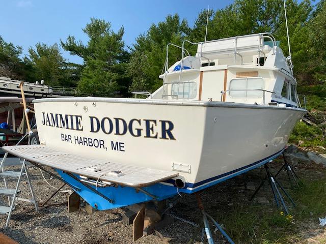 1972 Bertram Express boat "Jammie Dodger" on land, Bar Harbor, ME.