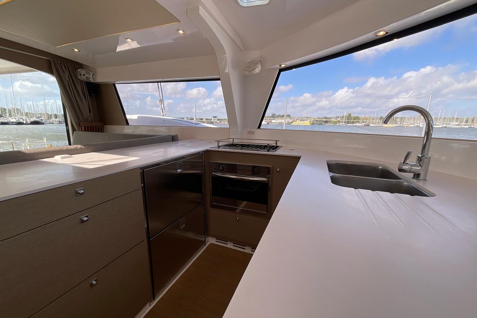 Modern kitchen interior on 2020 NEEL TRIMARNANS NEEL 47 yacht with ocean view.