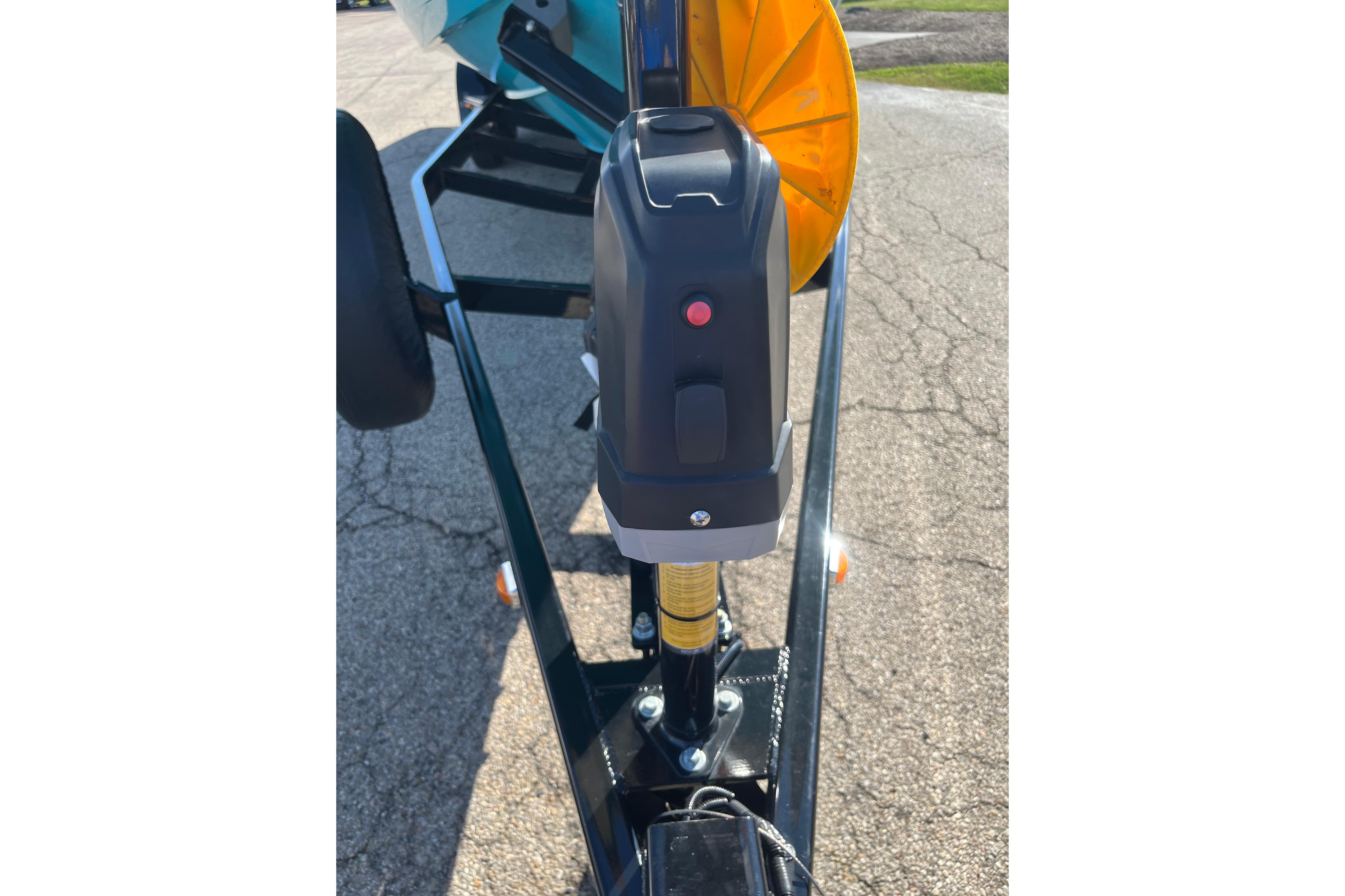 Trailer hitch of 2024 Regal LS9 Surf boat on pavement background.