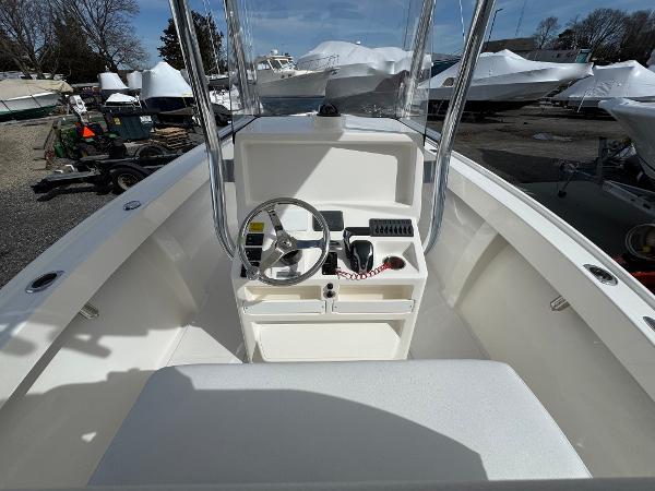 2025 NorthCoast 230 Center Console boat interior with steering wheel and controls.