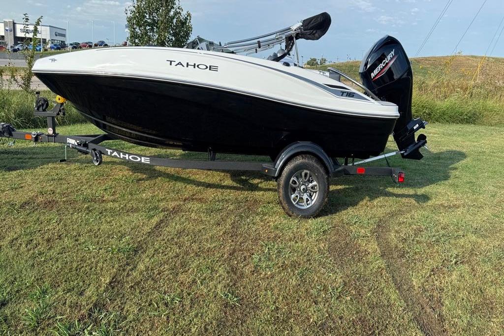 2026 Tahoe T16 boat on trailer, parked on grass, with Mercury outboard motor.