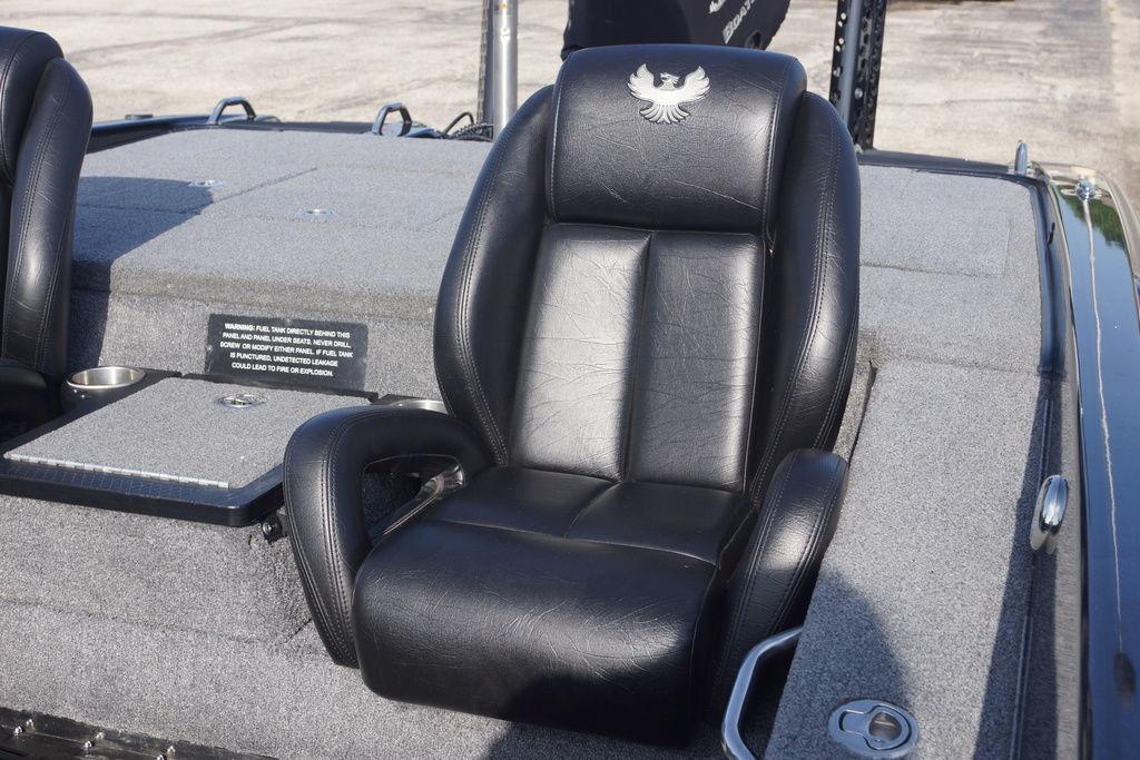 Black leather seat in 2025 Phoenix 921 Elite boat, featuring embroidered logo.
