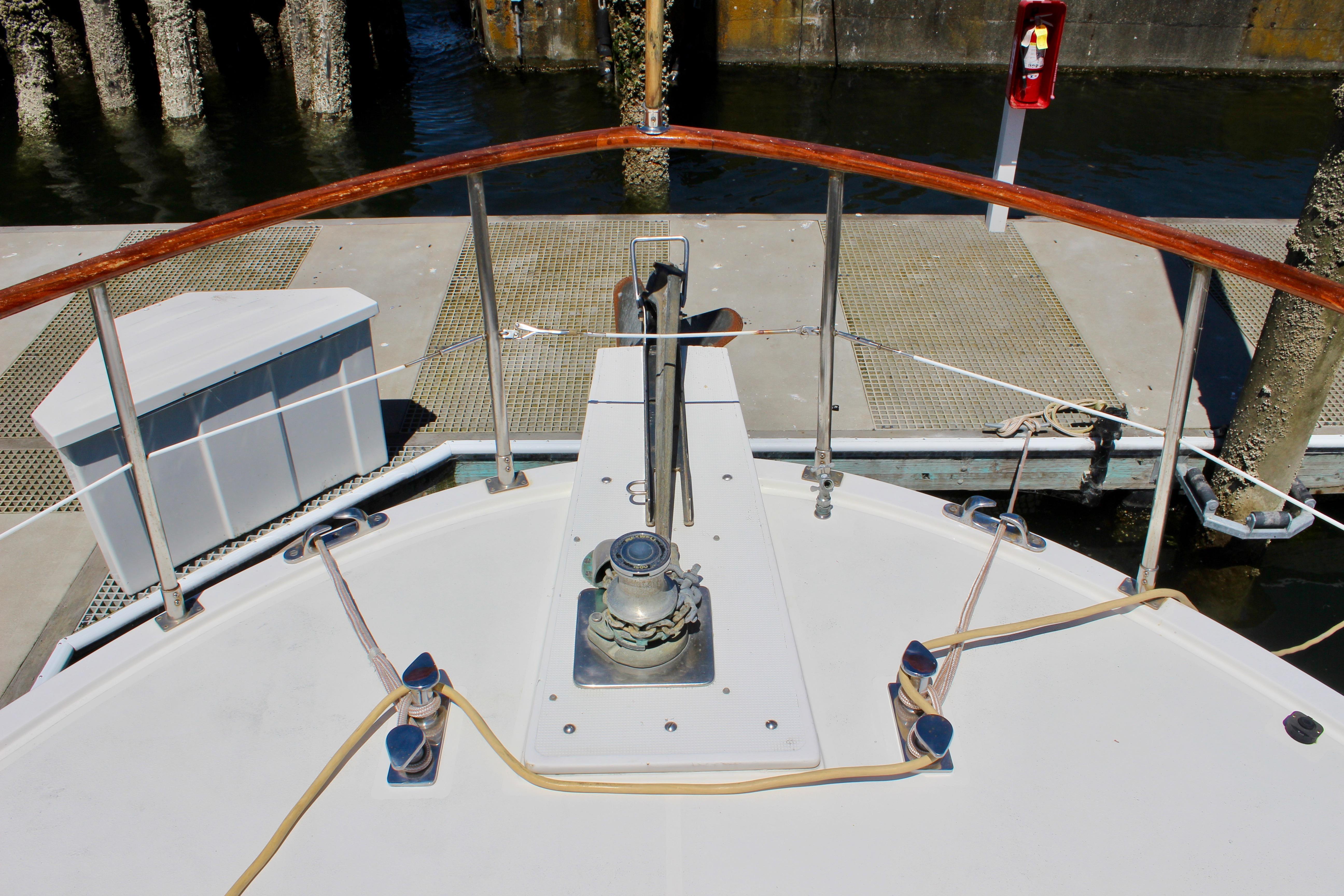 Bow of 1986 Kha Shing Spindrift 46 yacht docked at marina.