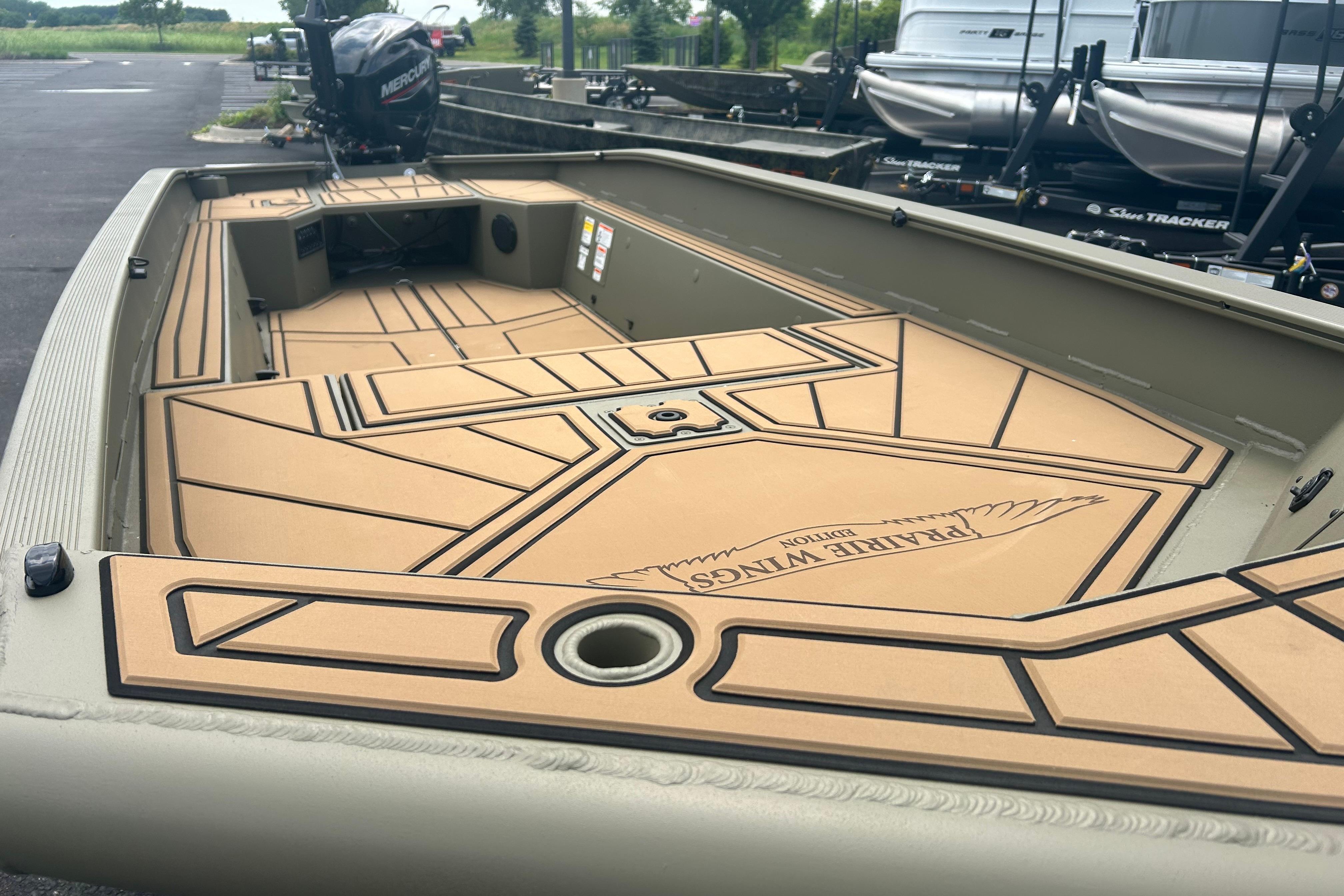 2026 Tracker Grizzly 1650 T Prairie Wings Edition boat interior with custom flooring.