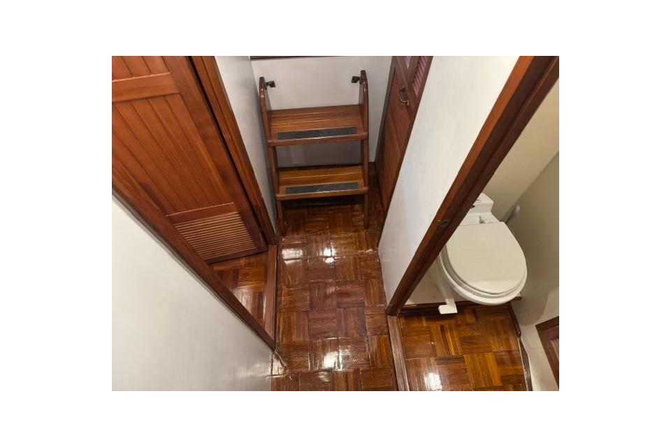 1986 Kadey-Krogen 42 yacht interior with wooden flooring and compact bathroom.