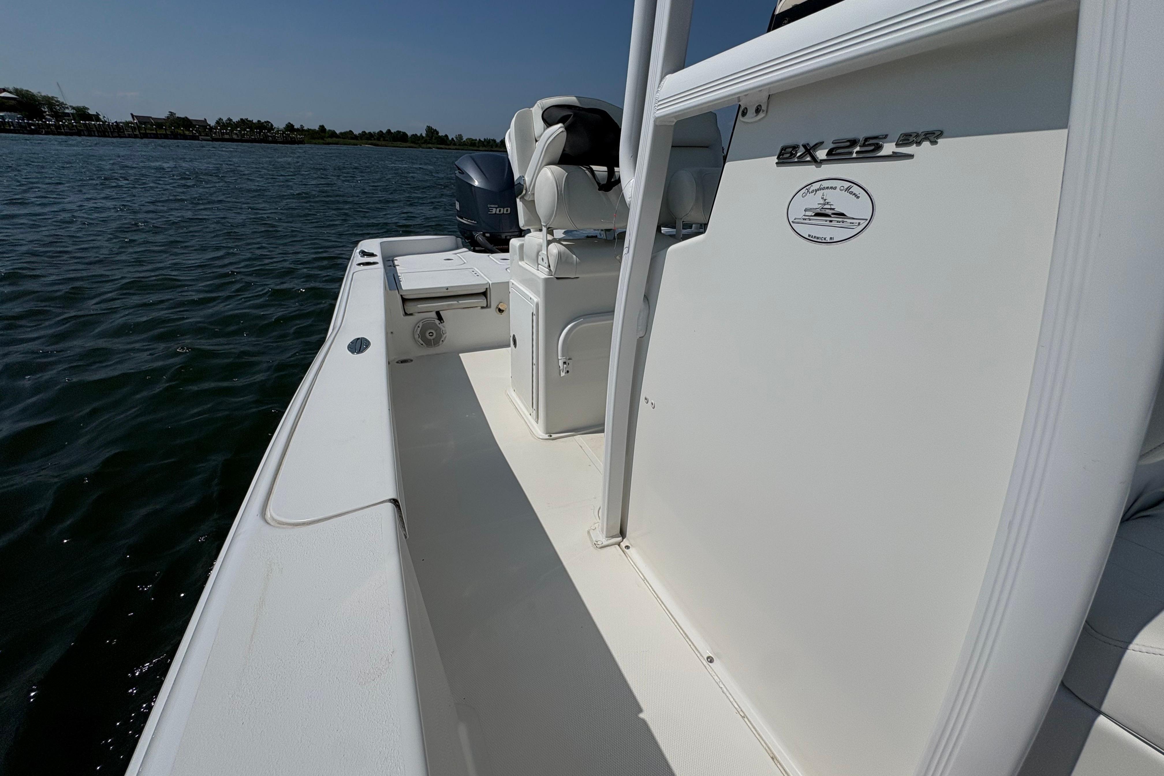 2017 Sea Hunt BX 25 BR boat on water, showcasing deck and seating area.