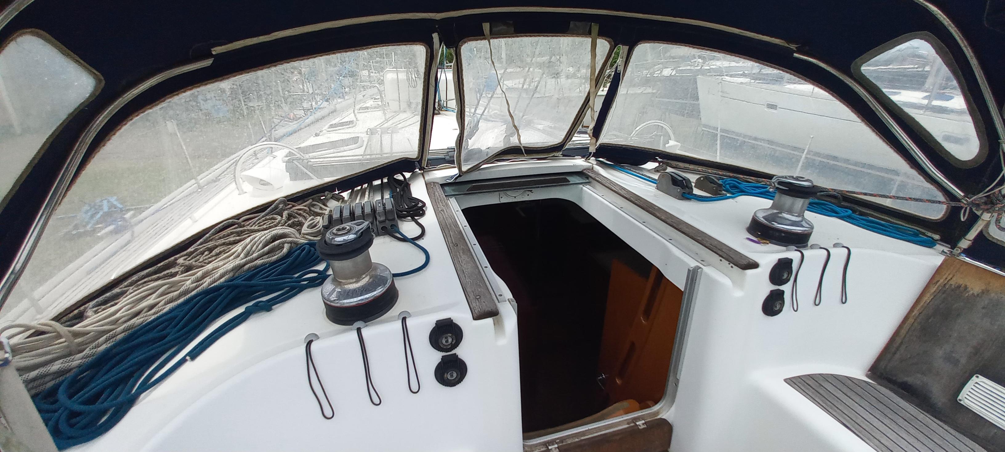 Cockpit of 2007 Beneteau Oceanis Clipper 523 sailboat with ropes and winches visible.