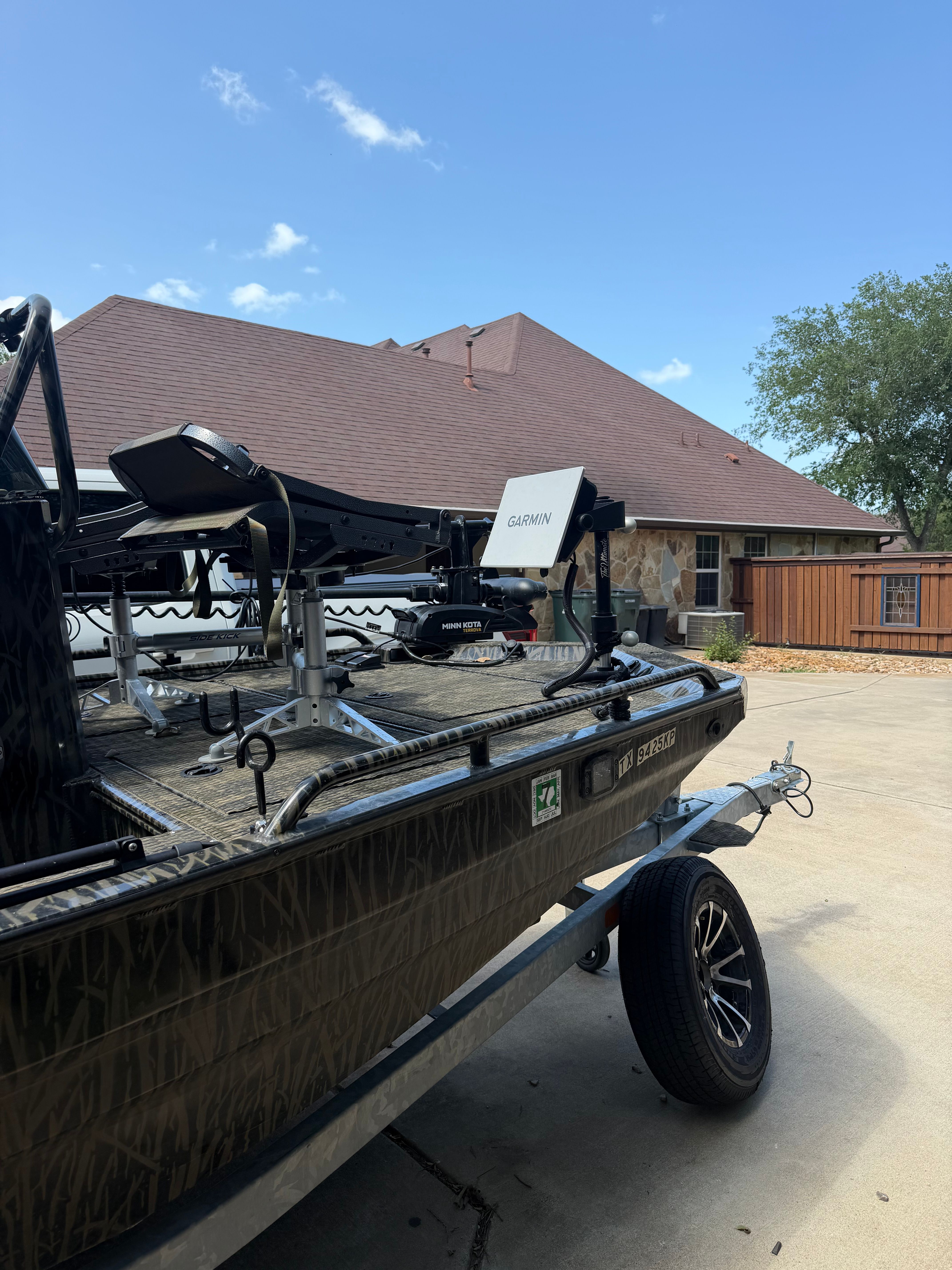 A 2023 Prodigy 1860 boat on a trailer, equipped with a Garmin device.