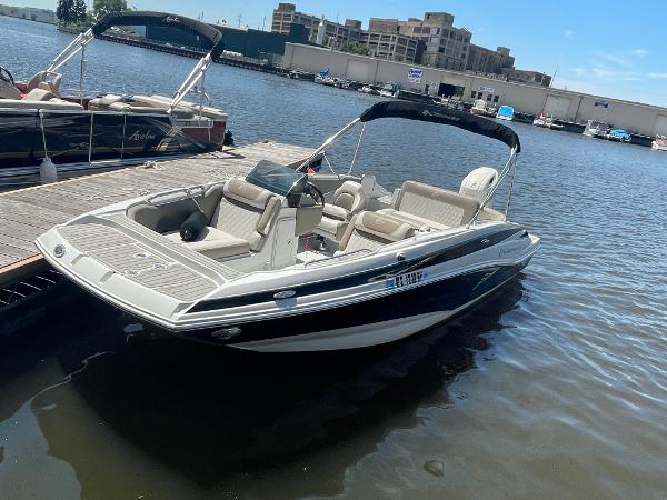 2020 Crownline E 205 XS boat docked on a sunny day.
