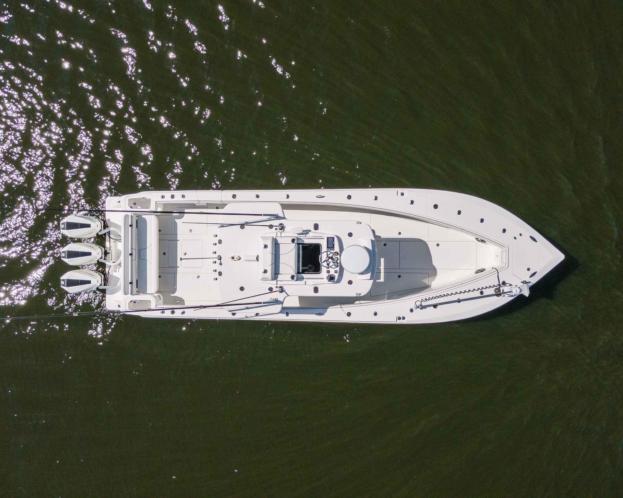 Aerial view of a white 2022 SeaVee 370Z boat on calm water.