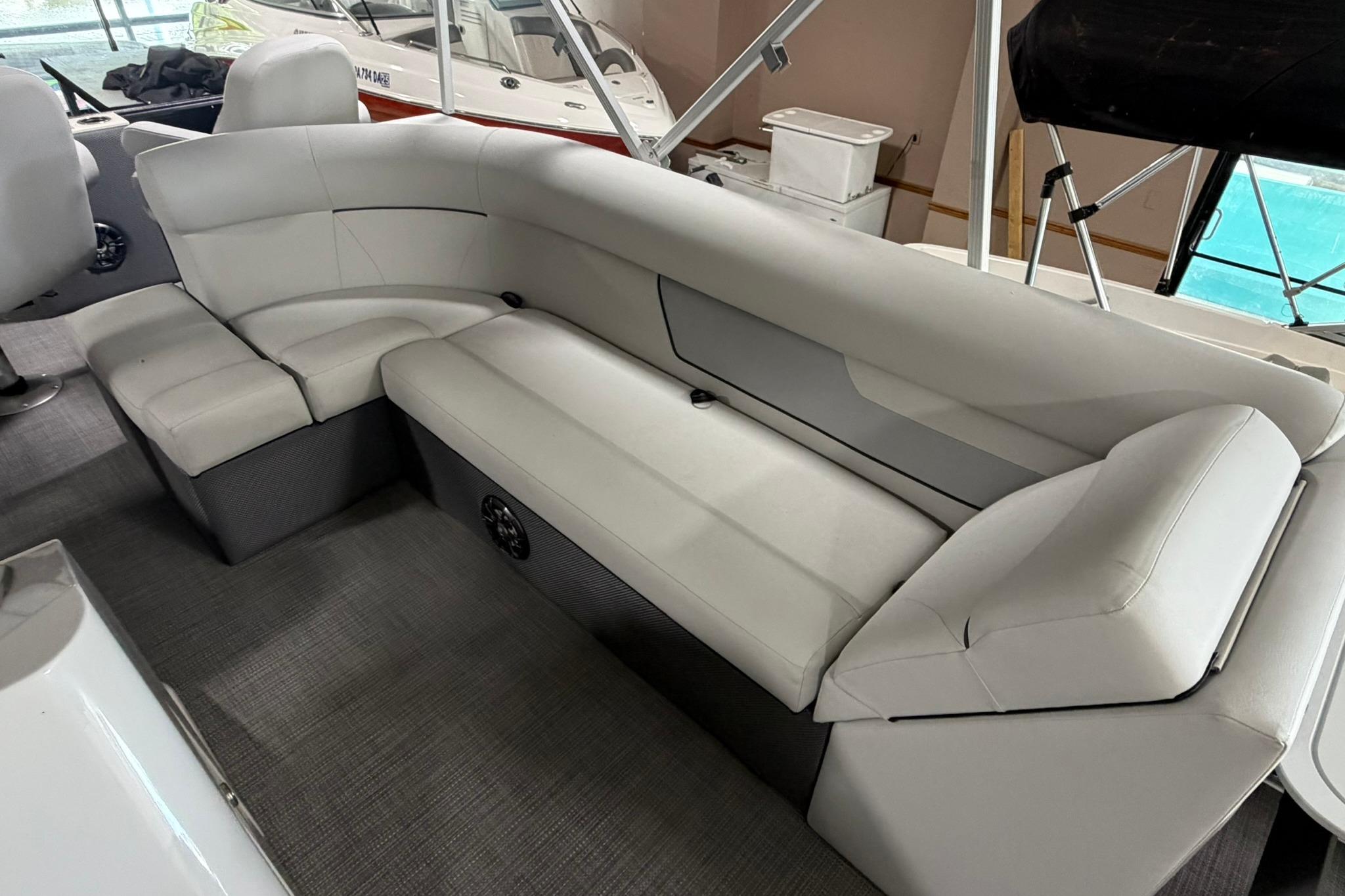2023 Crest Classic LX 200 boat interior with plush white seating and modern design.