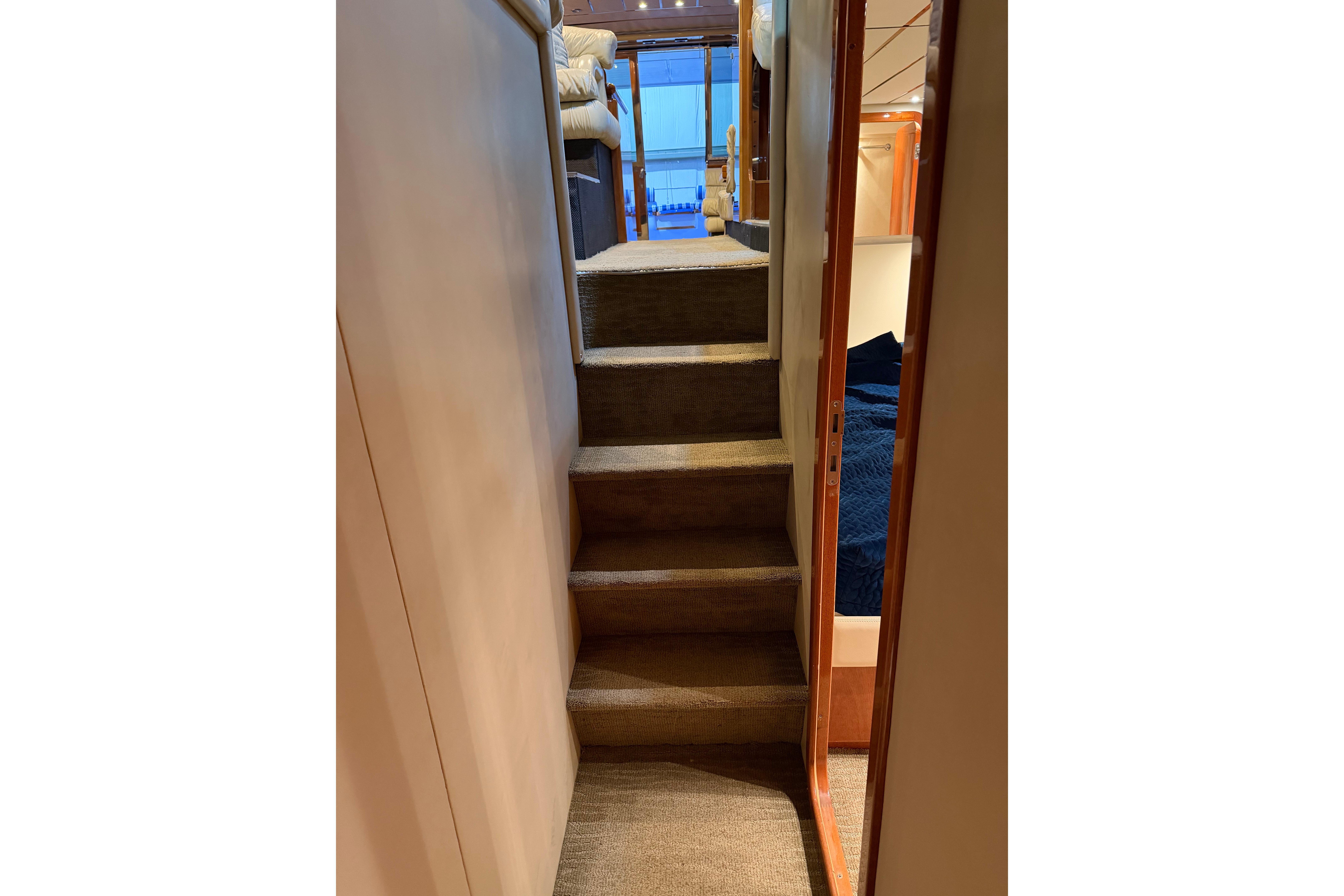 Staircase inside 1994 Ferretti Yachts 185 Fly, leading to upper deck area.