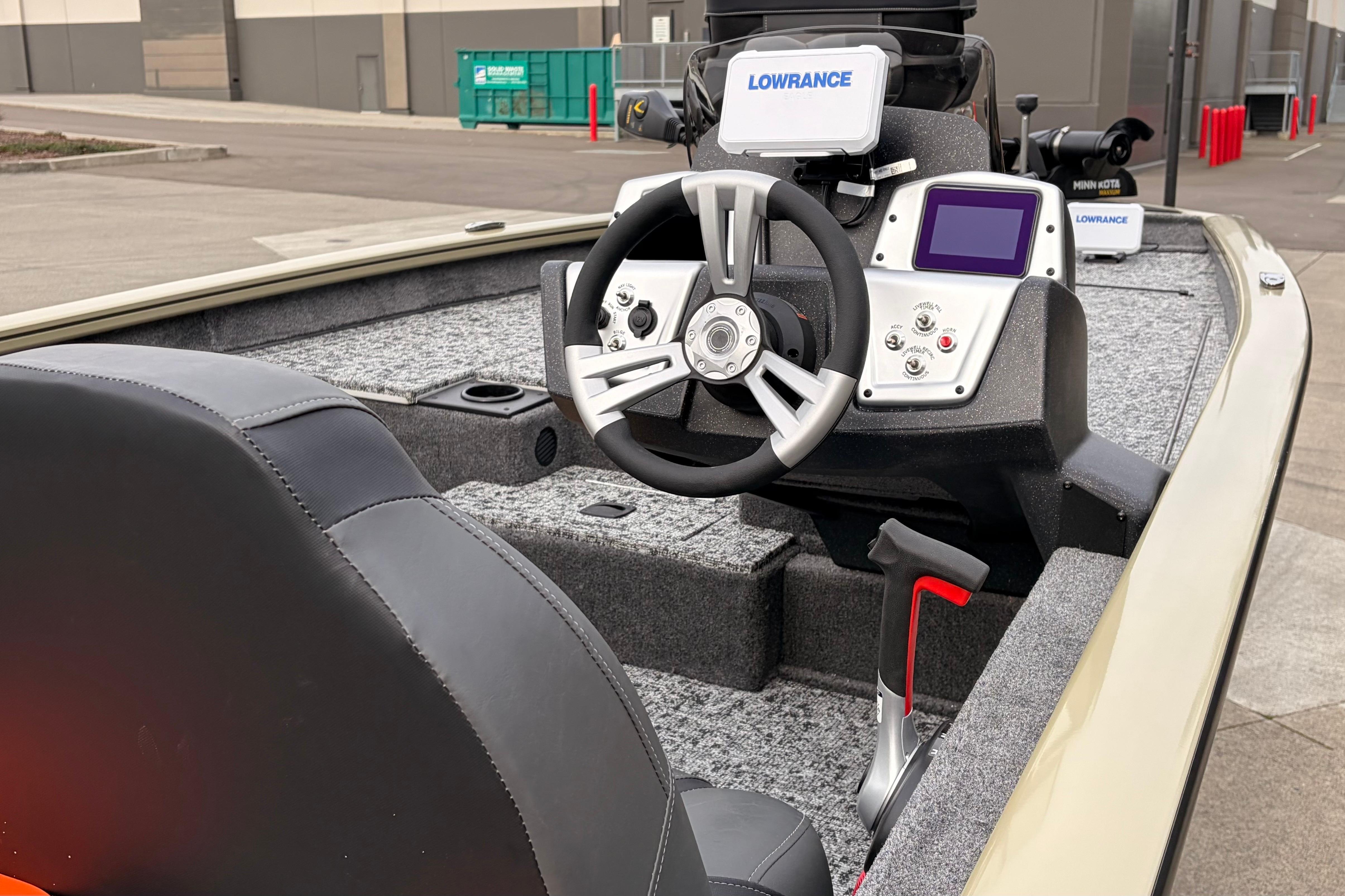2026 Tracker Pro Team 175 boat interior with steering wheel and navigation system.