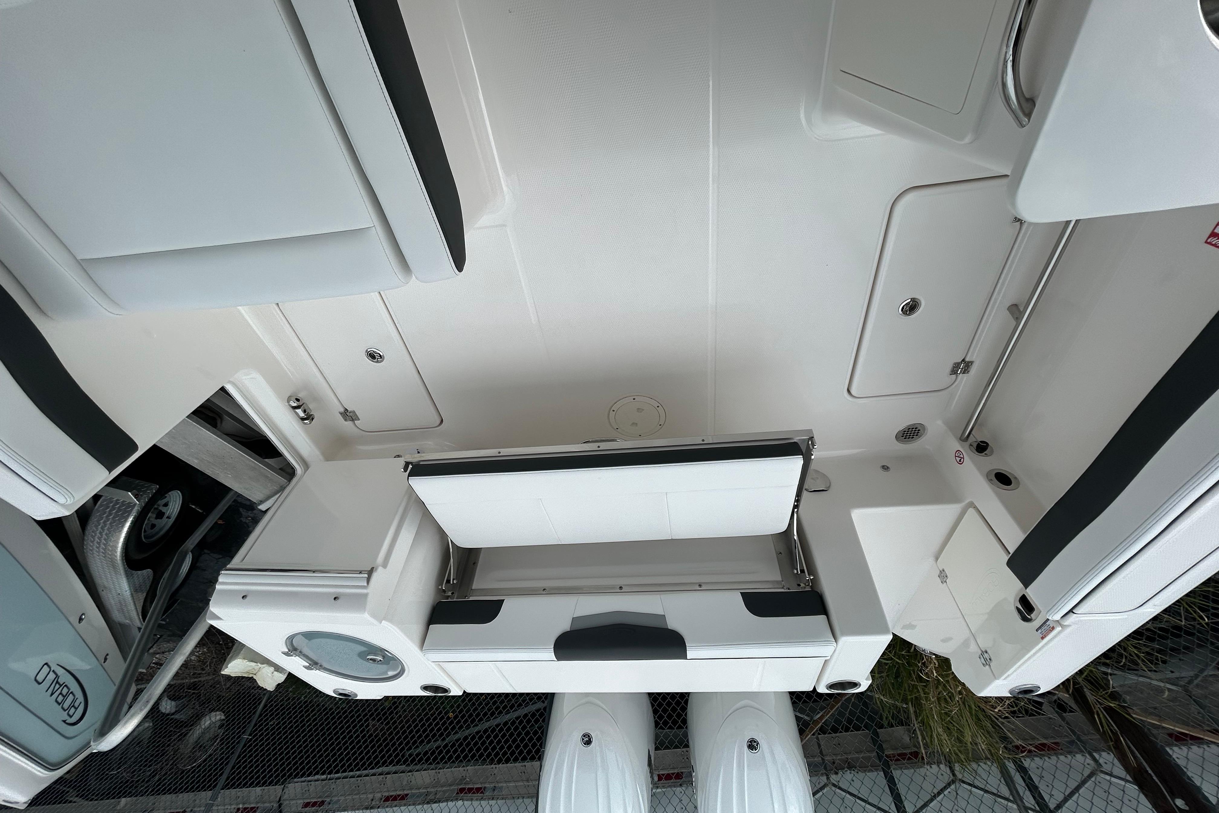 2026 Robalo R257 Dual Console boat interior with seating and storage compartments.