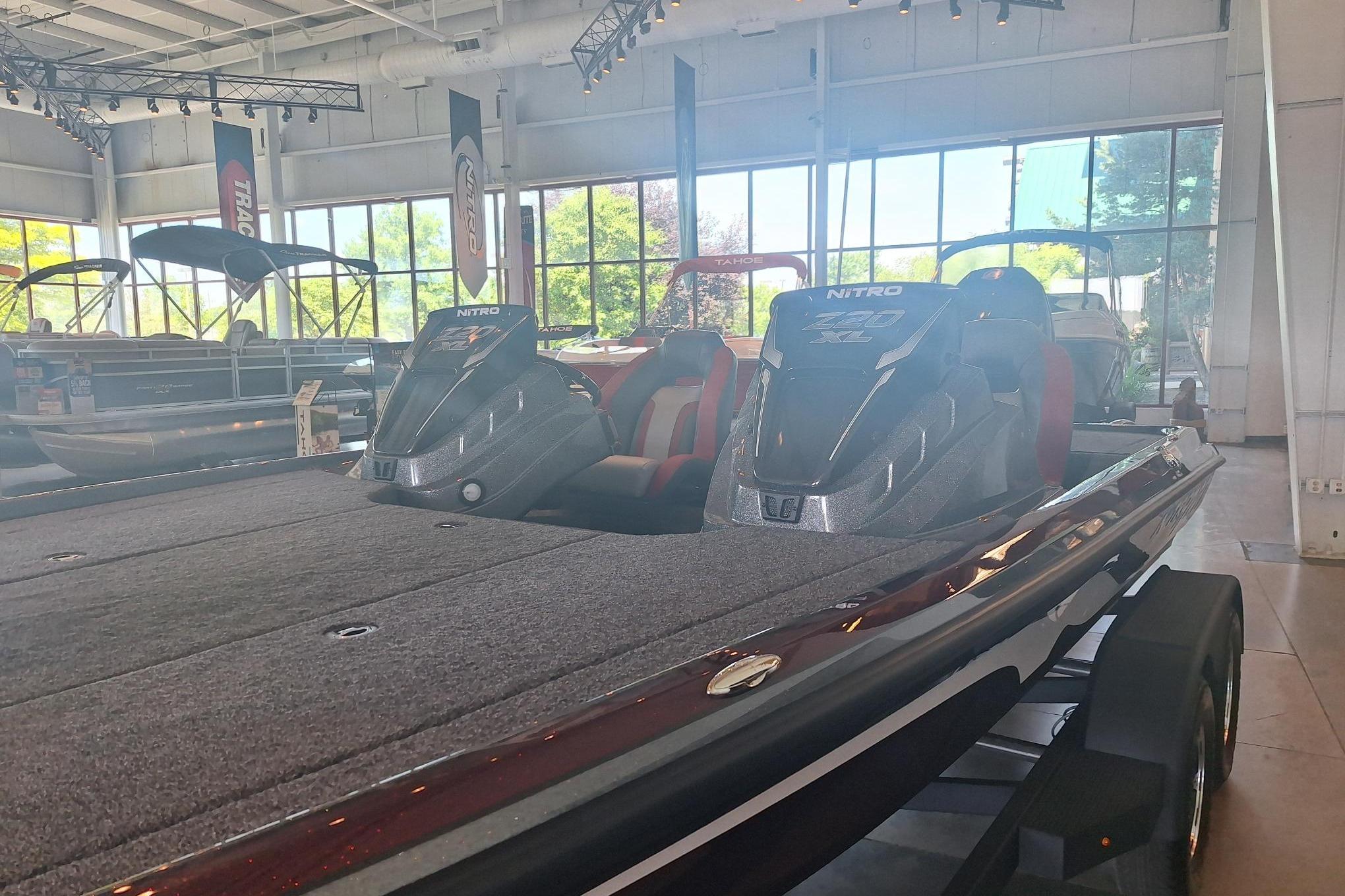 2026 Nitro Z20 XL boat displayed in a showroom with large windows.