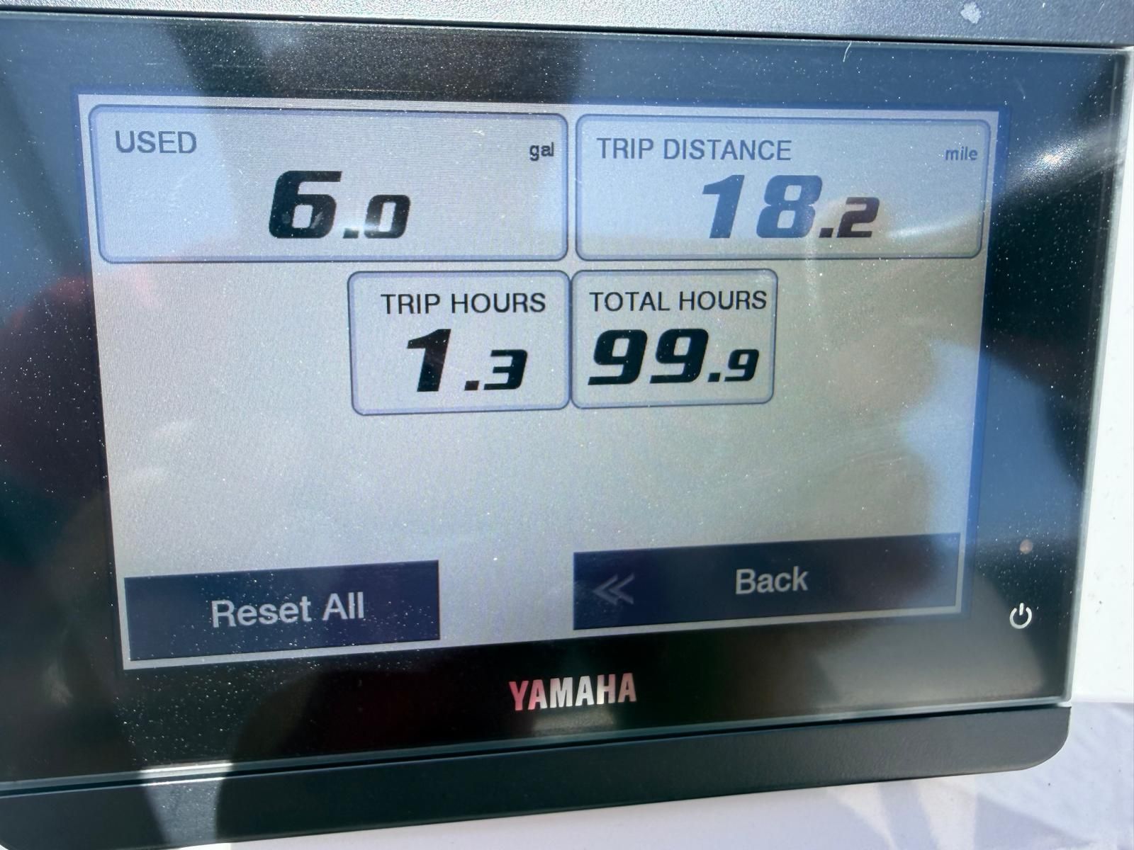 Yamaha display shows 6 gallons used, 18.2 miles trip distance, 1.3 trip hours, 99.9 total hours.