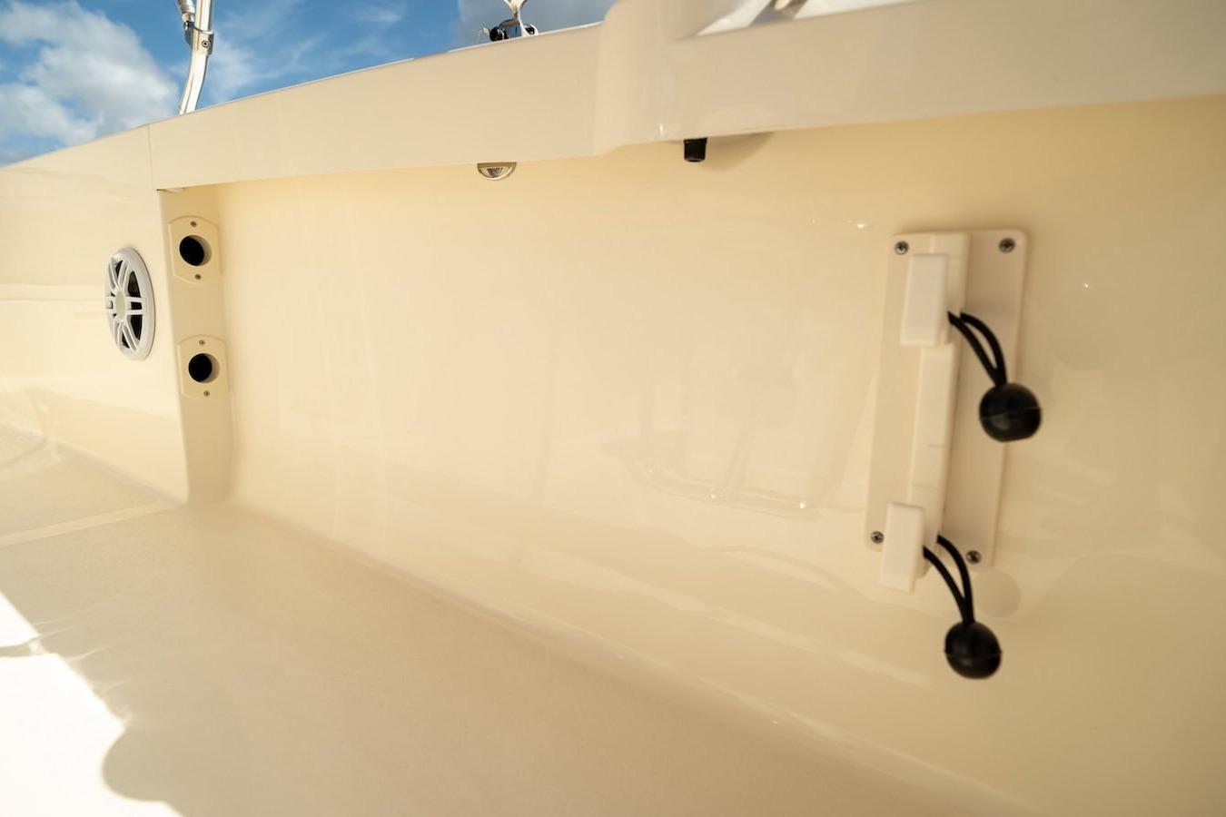 2026 Scout 188 Sportfish interior detail with speaker and rod holder.