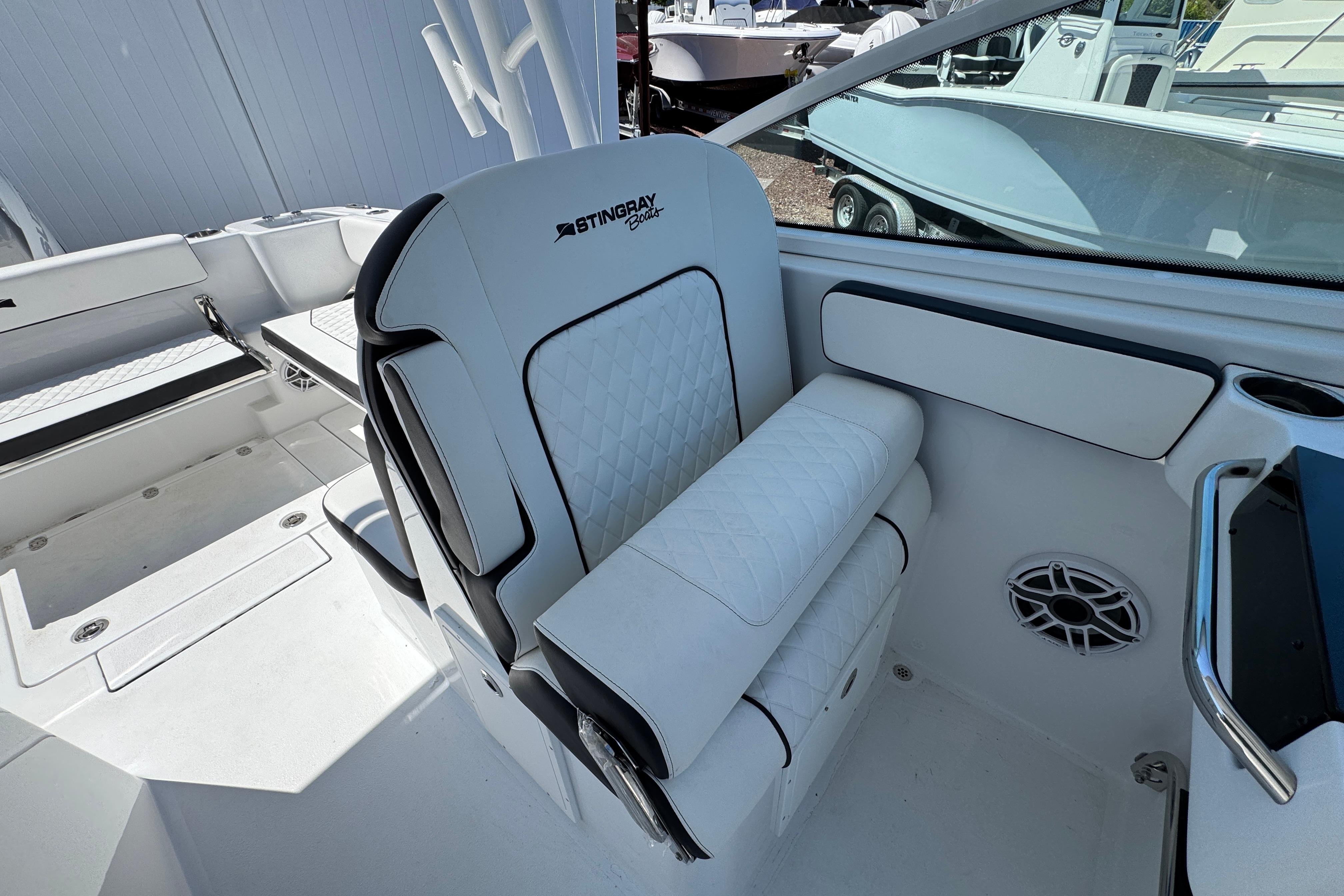 2026 Stingray 259 DC boat interior with white seating and modern design.