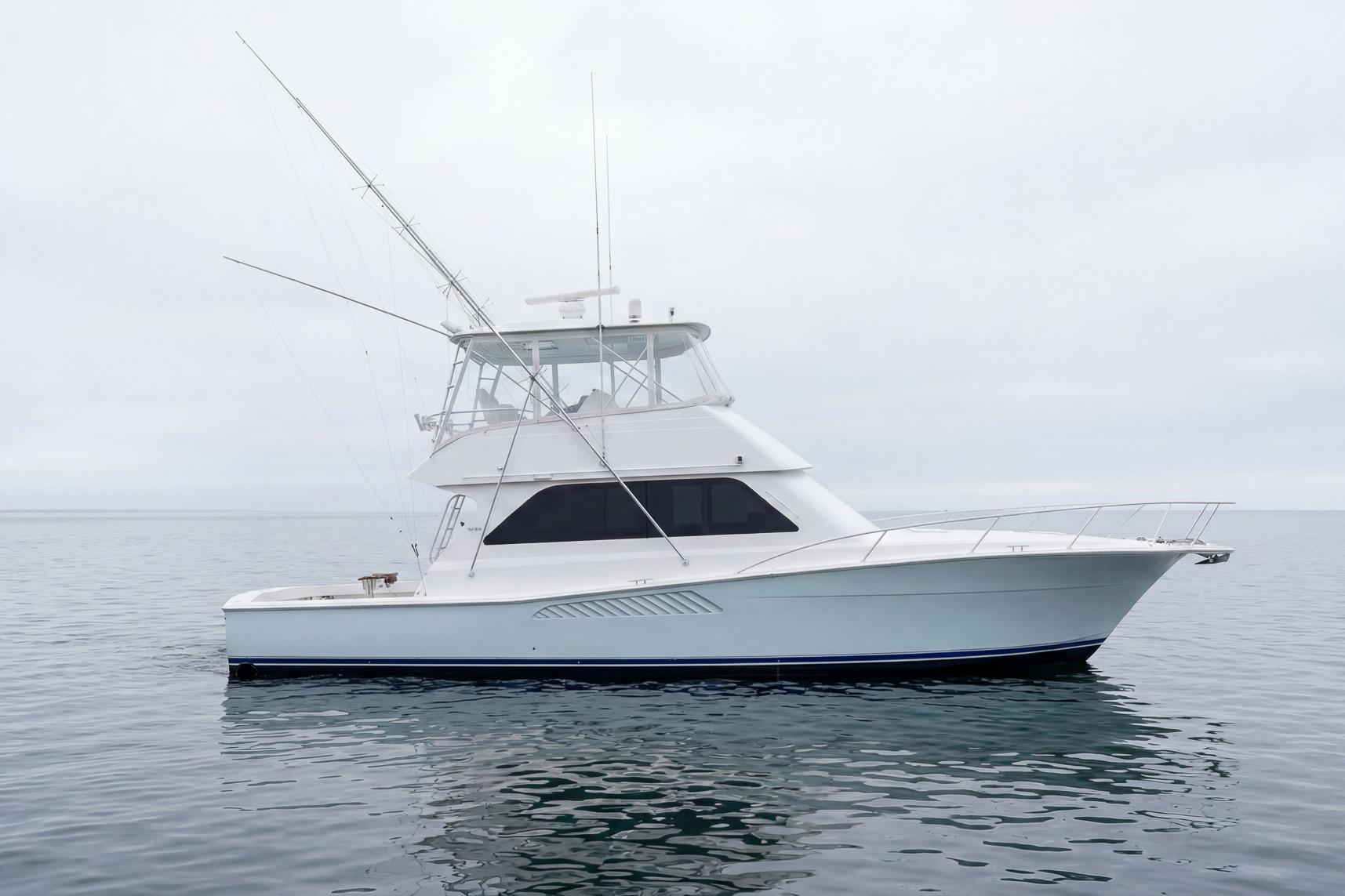 2000 Viking 50' Convertible yacht on calm water, side view.