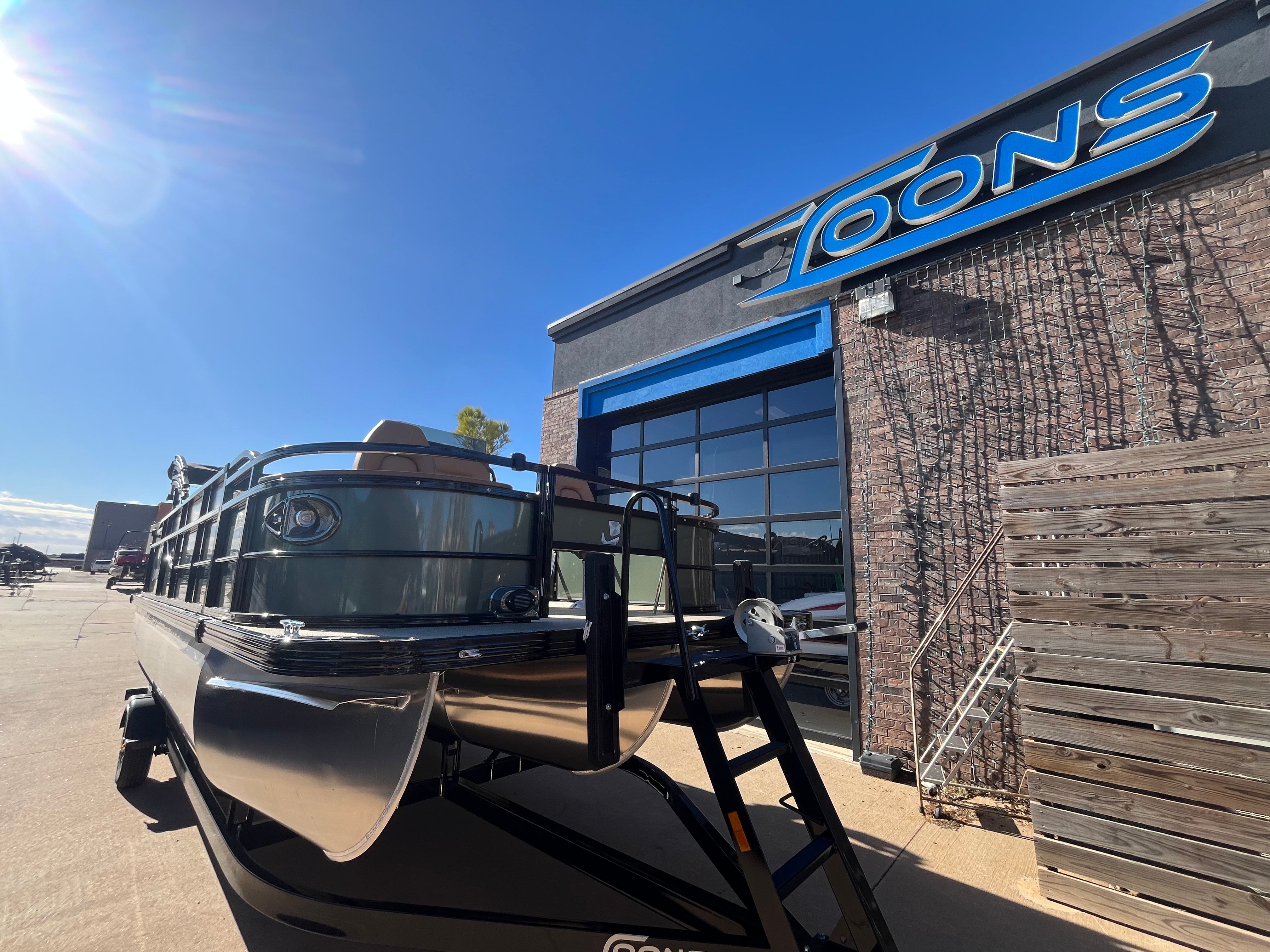 2026 Landau Alure 21CC Fish boat in front of a building.