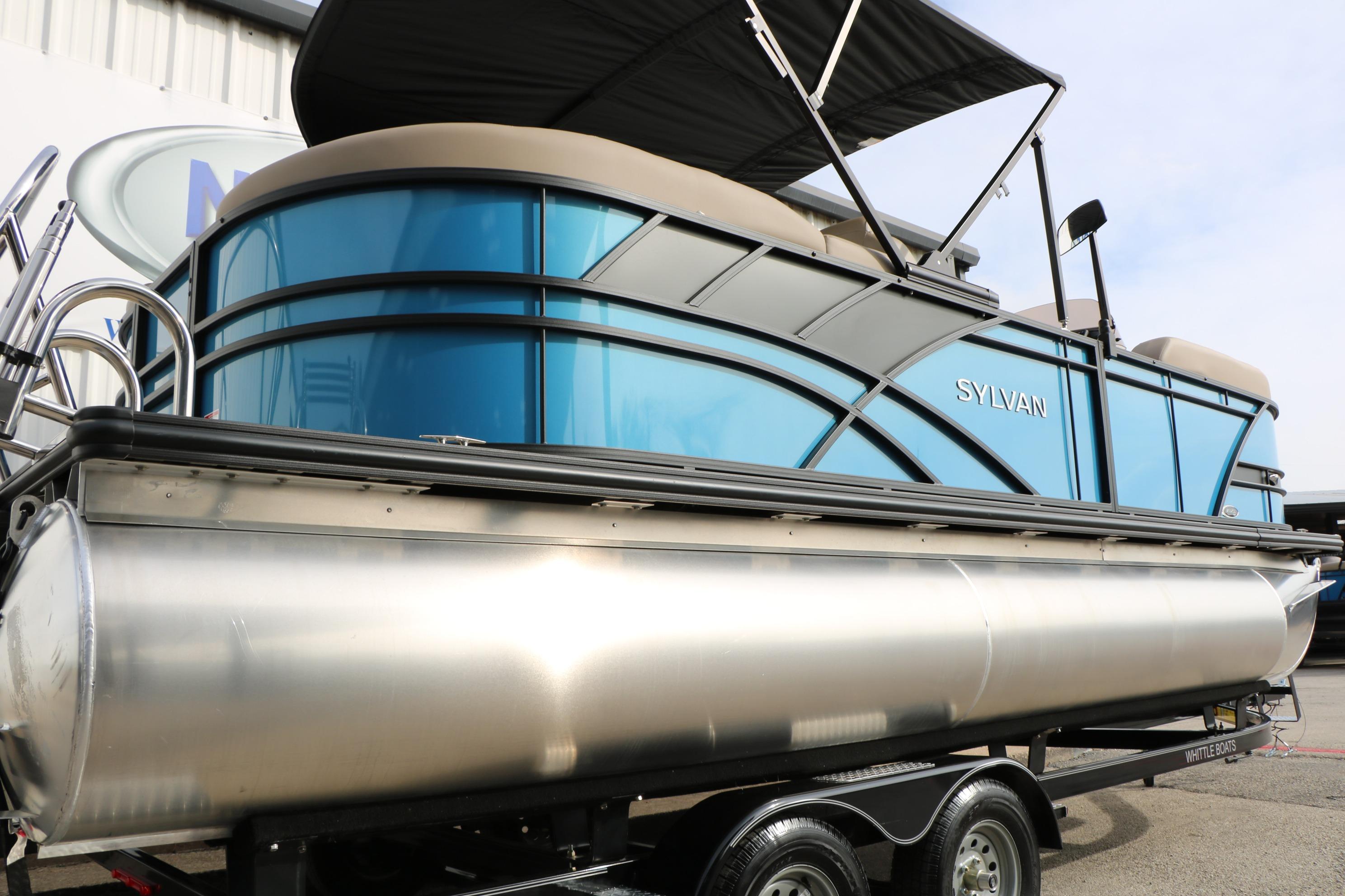 2026 Sylvan Mirage 822 LZ pontoon boat with sleek blue design on trailer.