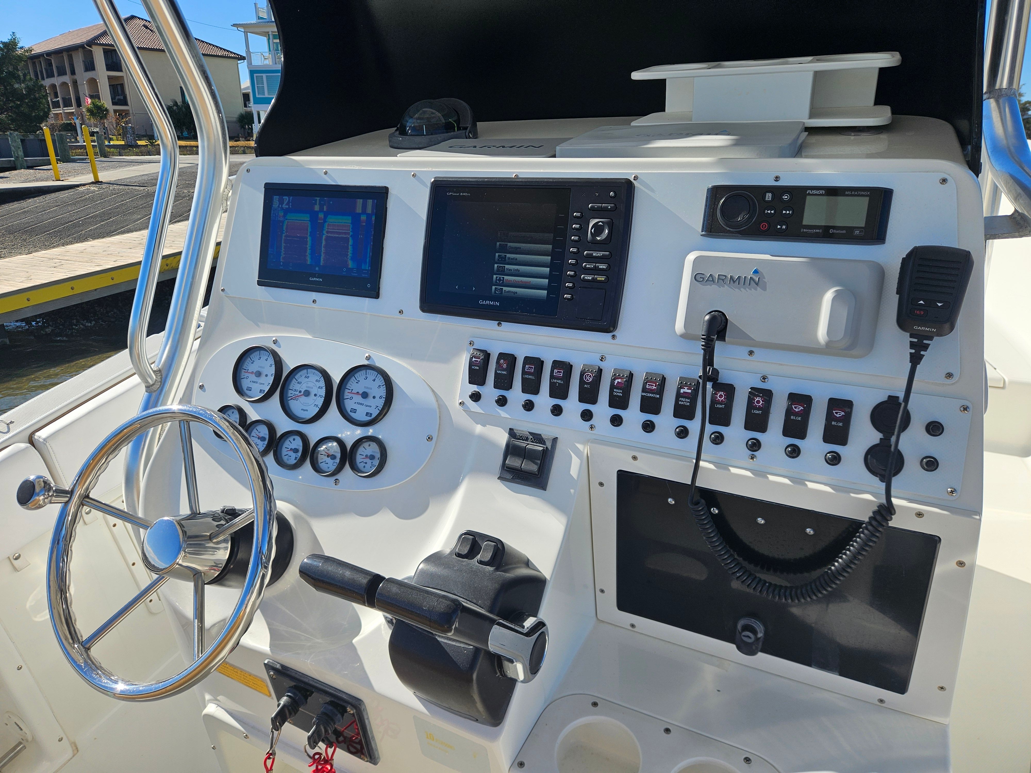 Dashboard of a 2004 Triton 2690 CC boat with Garmin electronics.
