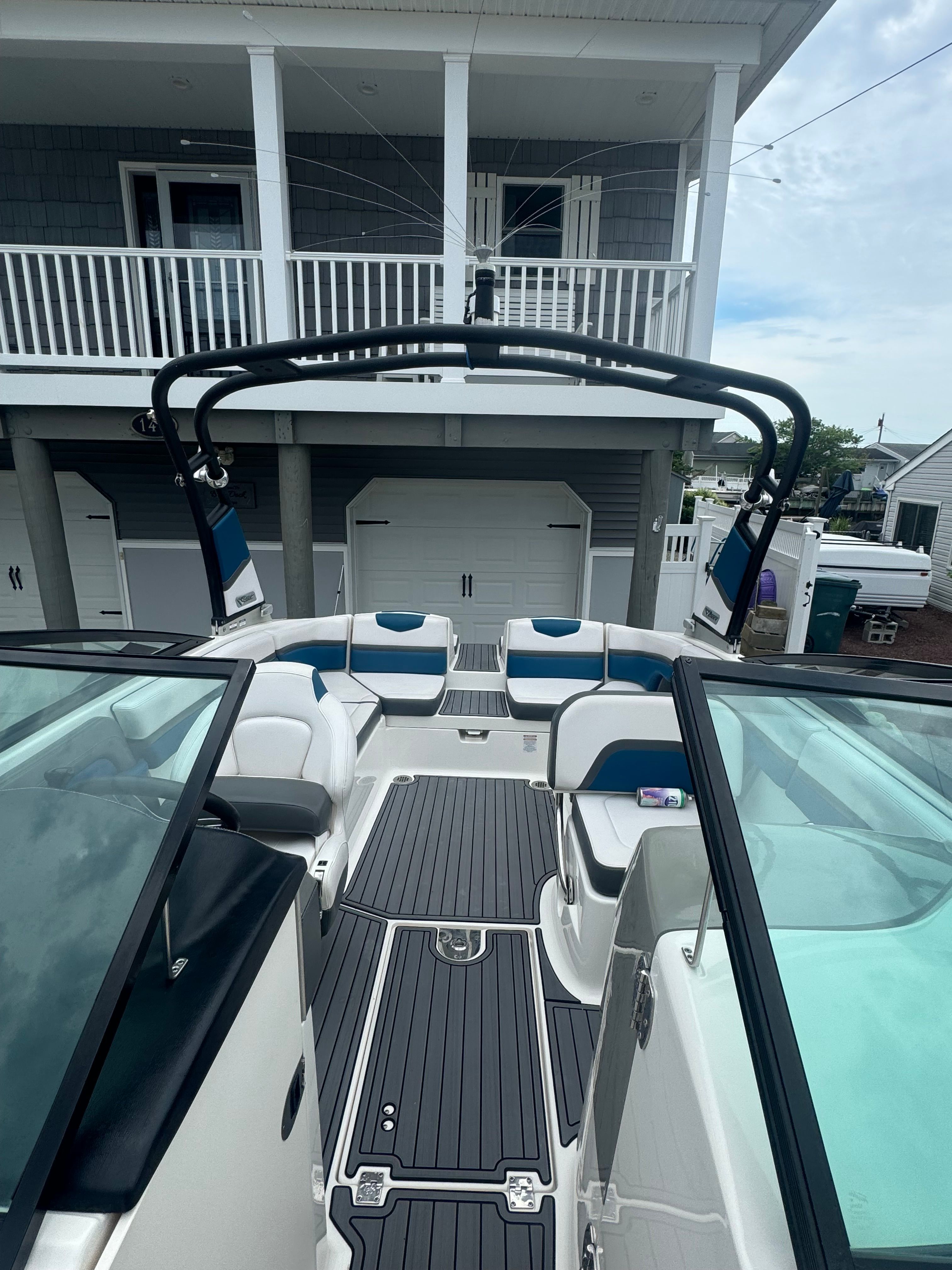 The image shows the cockpit of a 2016 Chaparral Vortex 243 VRX with modern seating.