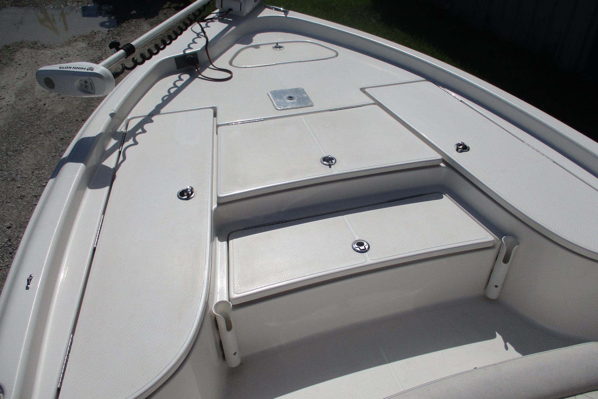 2021 Blue Wave 2000 PureBay boat deck with storage compartments and trolling motor.
