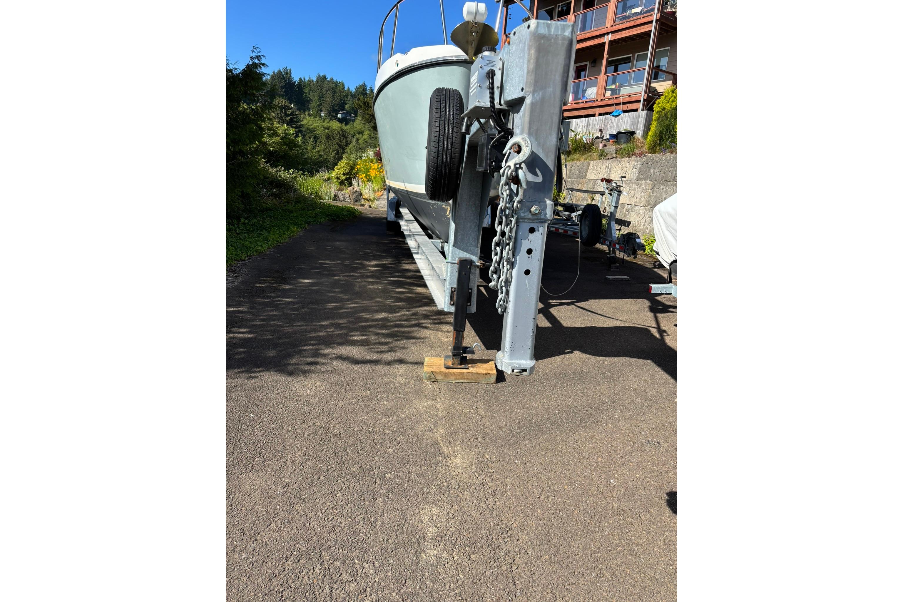 2020 SeaPiper 35 boat on trailer, parked outdoors in sunny setting.
