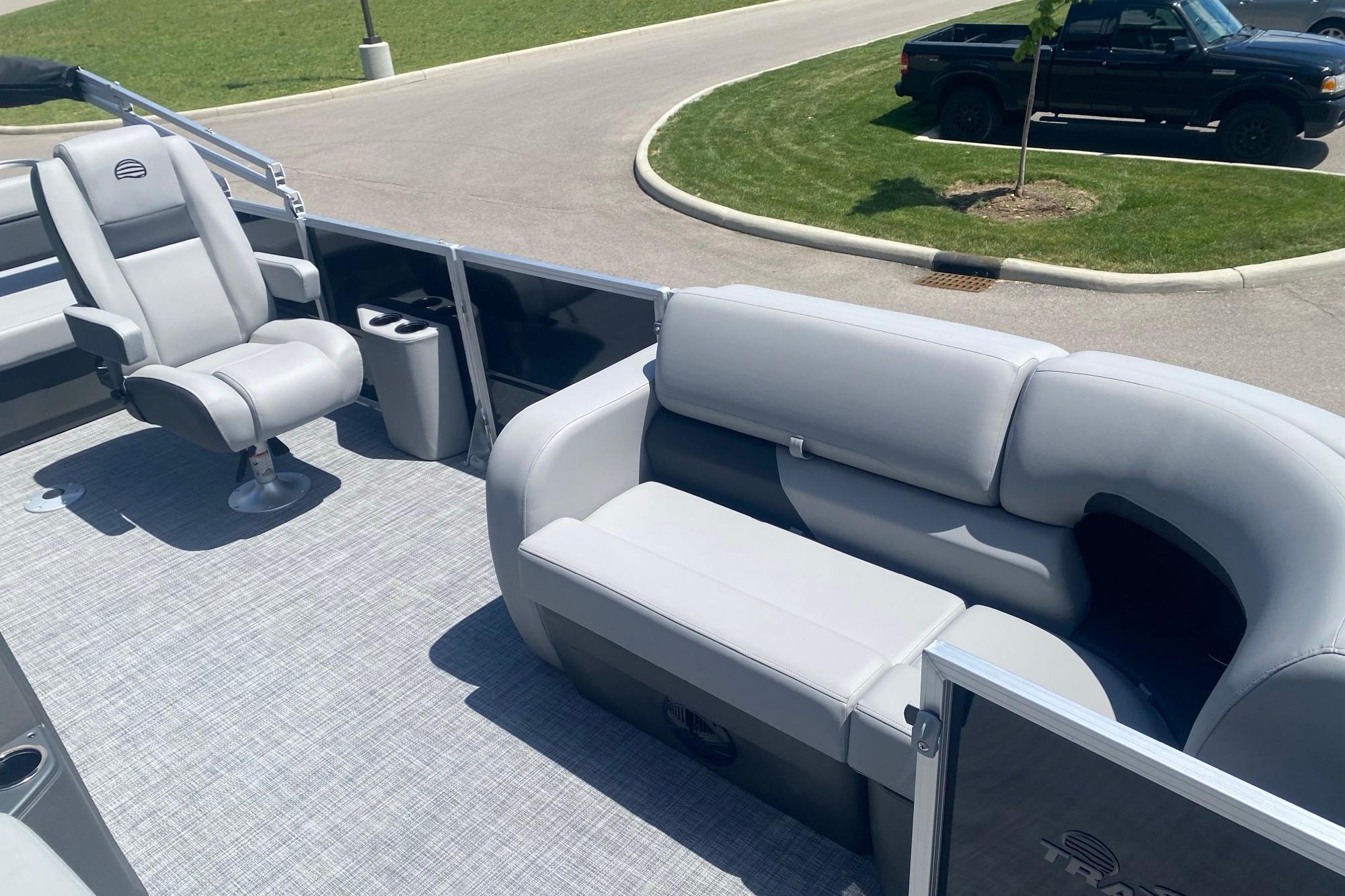 2026 Sun Tracker Party Barge 22 RF DLX with gray seating and spacious deck.