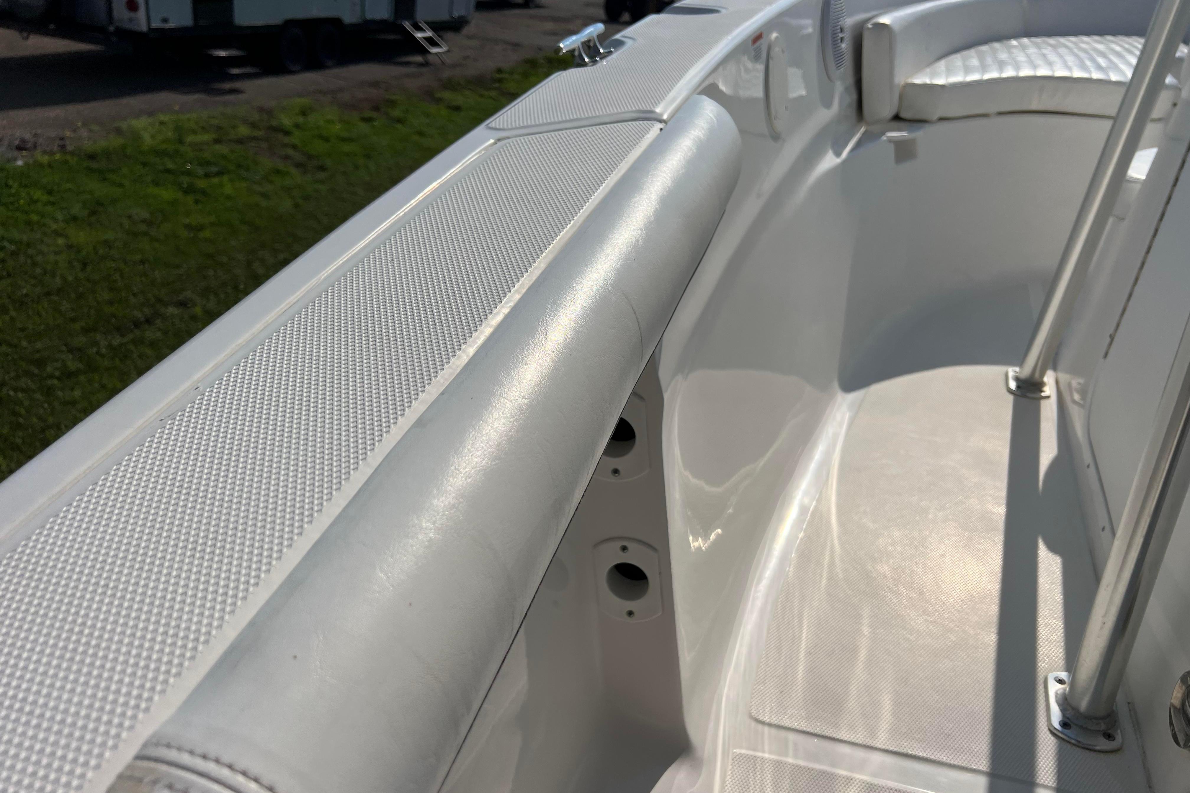 2012 Sea Fox 206 Center Console boat interior with white seating and stainless steel railings.