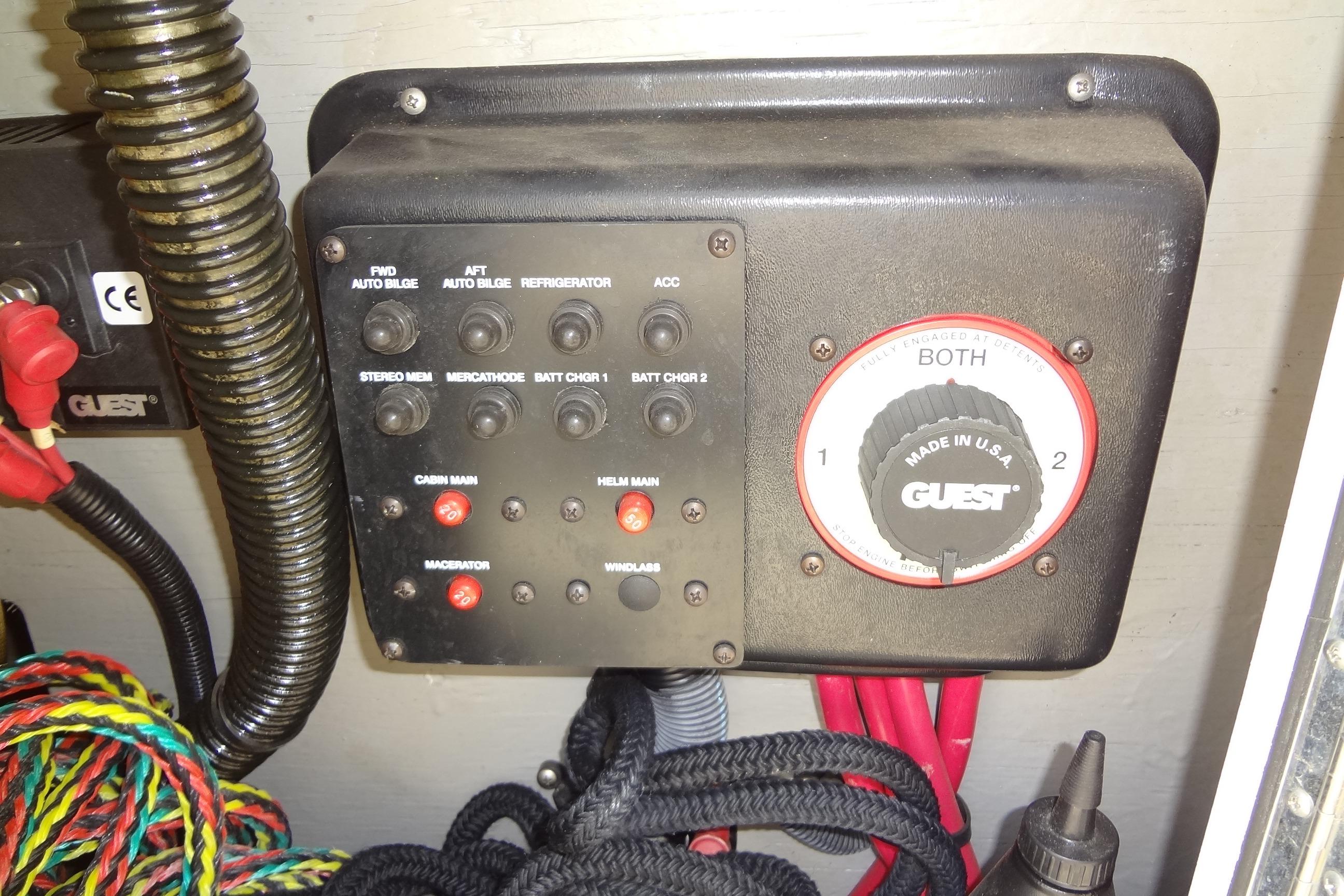 Control panel of a 2000 Chaparral Signature 260 boat with various switches and wiring.