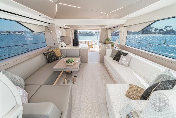 Luxurious interior of 2025 Sunseeker Manhattan 68 yacht with elegant seating and ocean view.