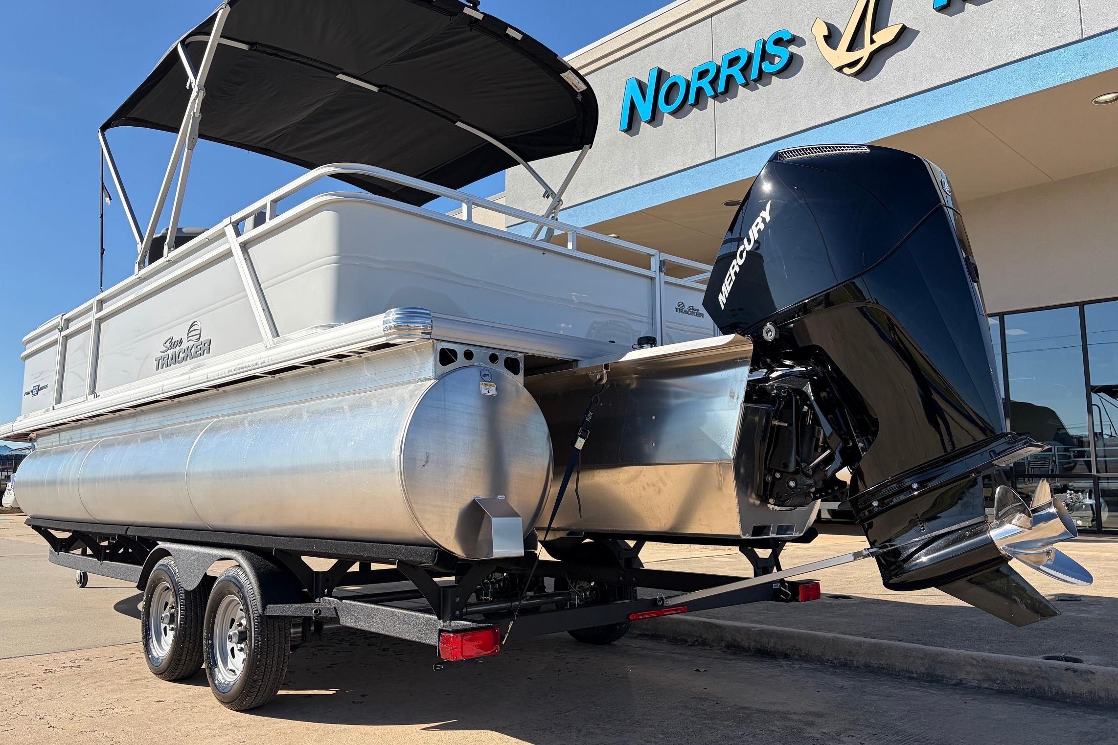 2026 Sun Tracker Party Barge 22 RF XP3 pontoon boat with Mercury engine on trailer.