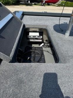 Ranger RT198P 2025 boat with open storage compartment and cables.