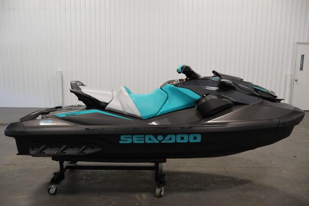 2026 Sea-Doo GTR 230 jet ski in a showroom, featuring a sleek design and vibrant colors.