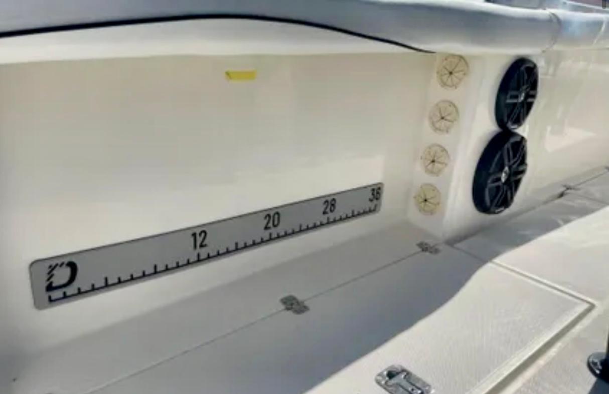 2006 Wellcraft 32 CCF boat interior with speakers and measurement scale.