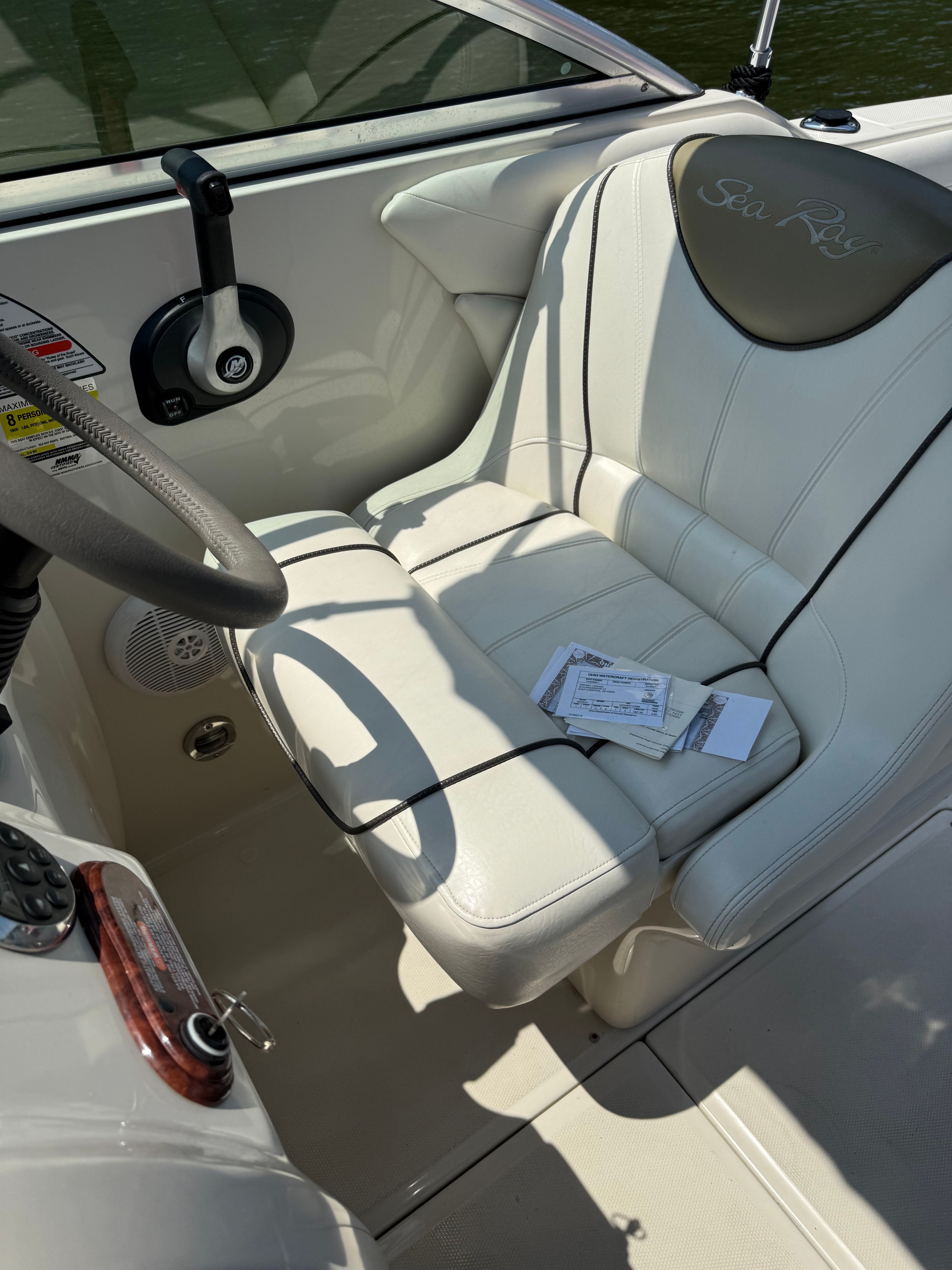 Interior of a 2006 Sea Ray 215 Weekender boat with white seat.