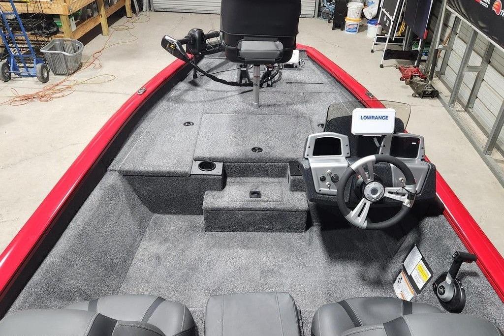 2026 Tracker Pro Team 175 boat interior with steering wheel and Lowrance electronics.